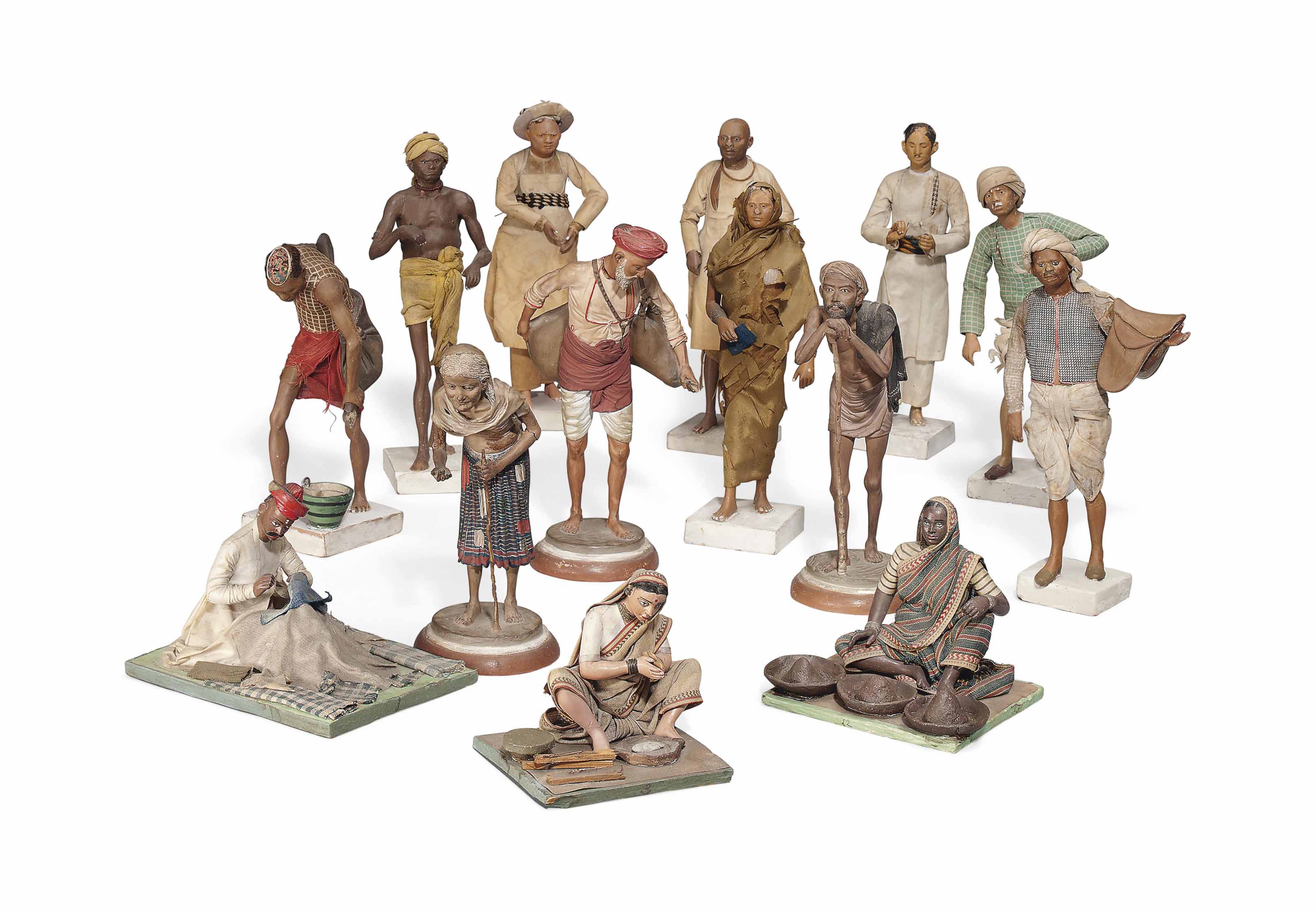 A GROUP OF FOURTEEN INDIAN TERRACOTTA FIGURES