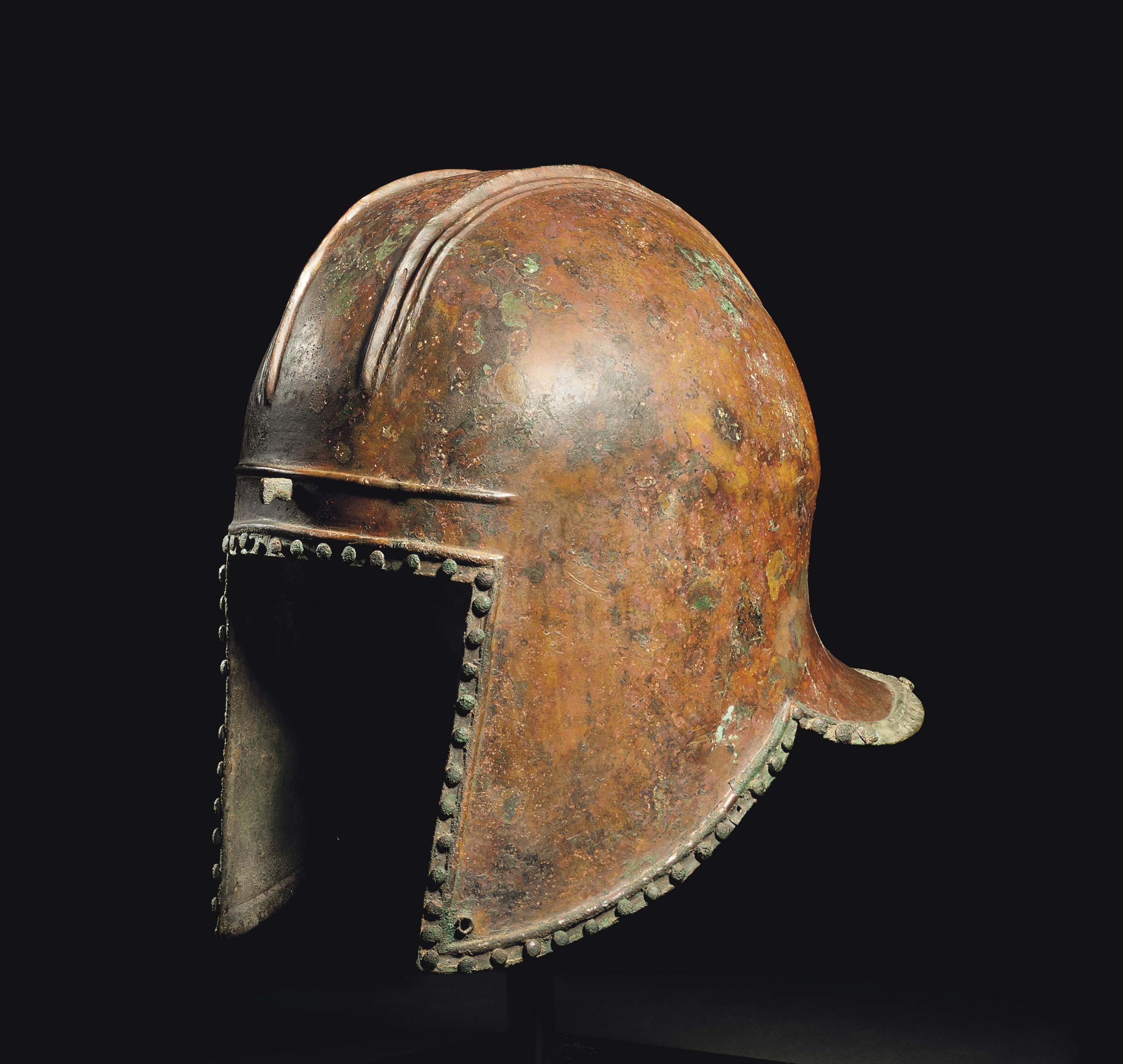 A GREEK BRONZE ILLYRIAN HELMET , ARCHAIC PERIOD, CIRCA 6TH CENTURY B.C