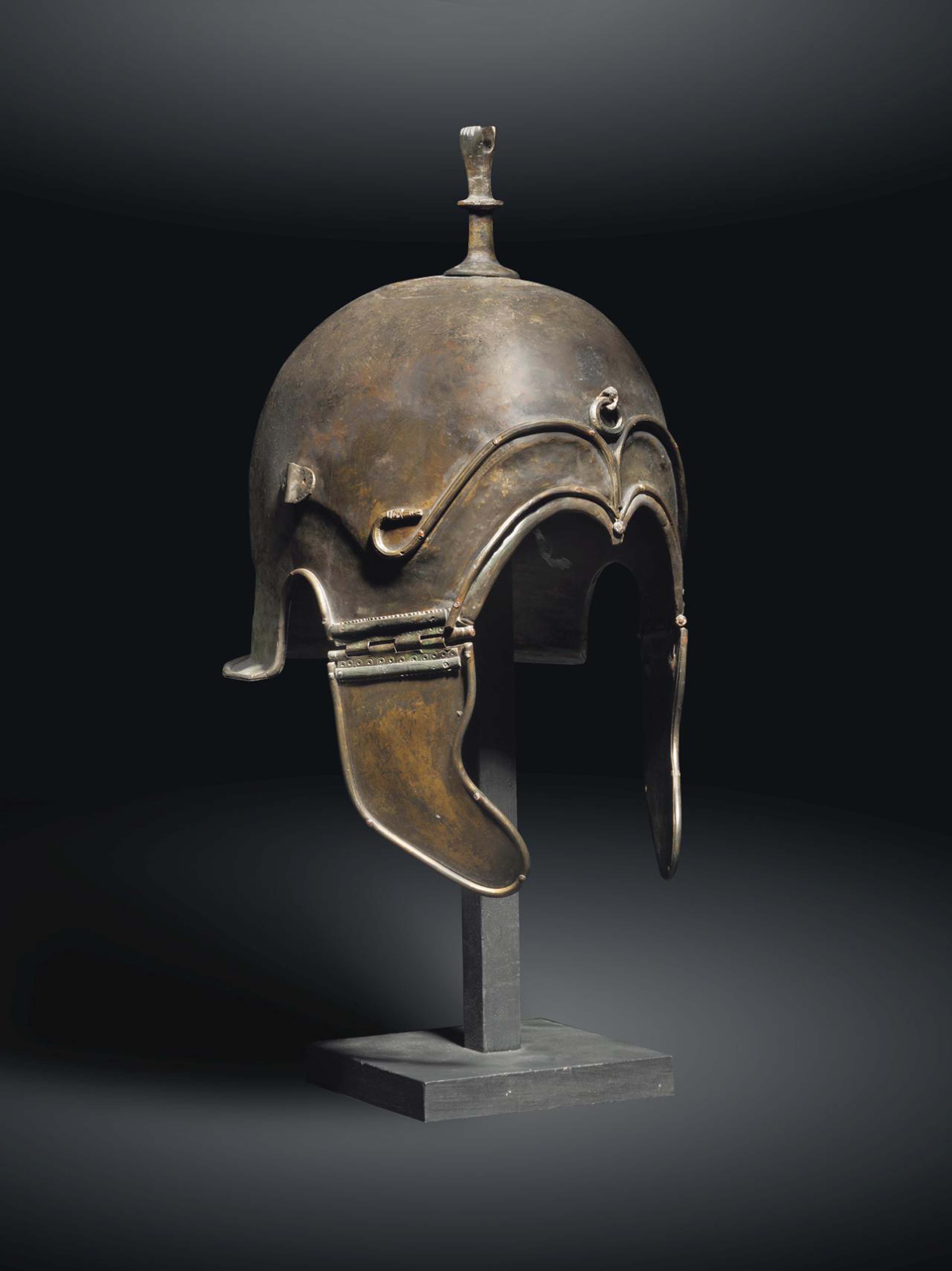 A GREEK BRONZE HELMET OF CHALCIDIAN TYPE , LATE CLASSICAL PERIOD, CIRCA