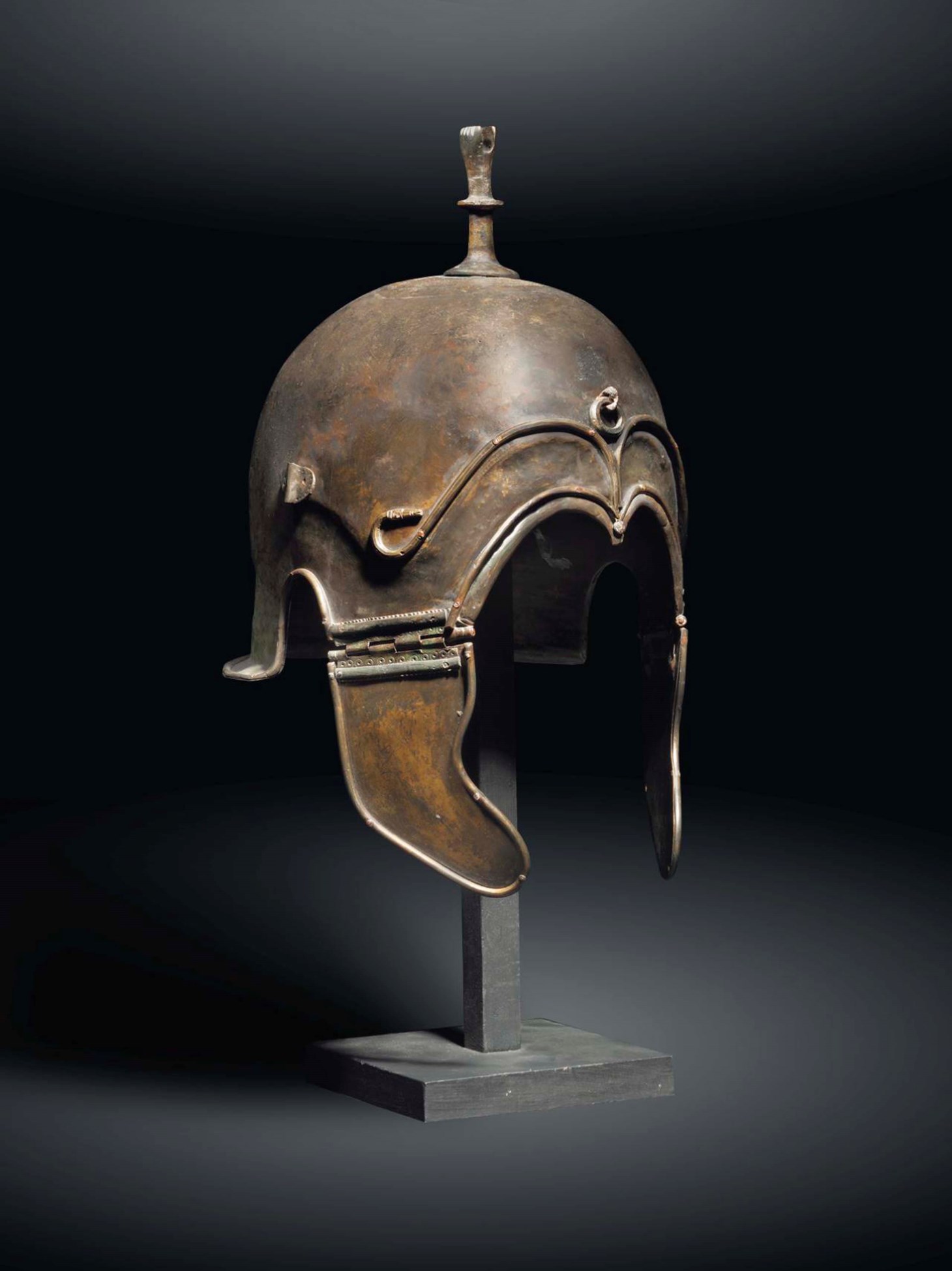 A GREEK BRONZE HELMET OF CHALCIDIAN TYPE , LATE CLASSICAL PERIOD, CIRCA
