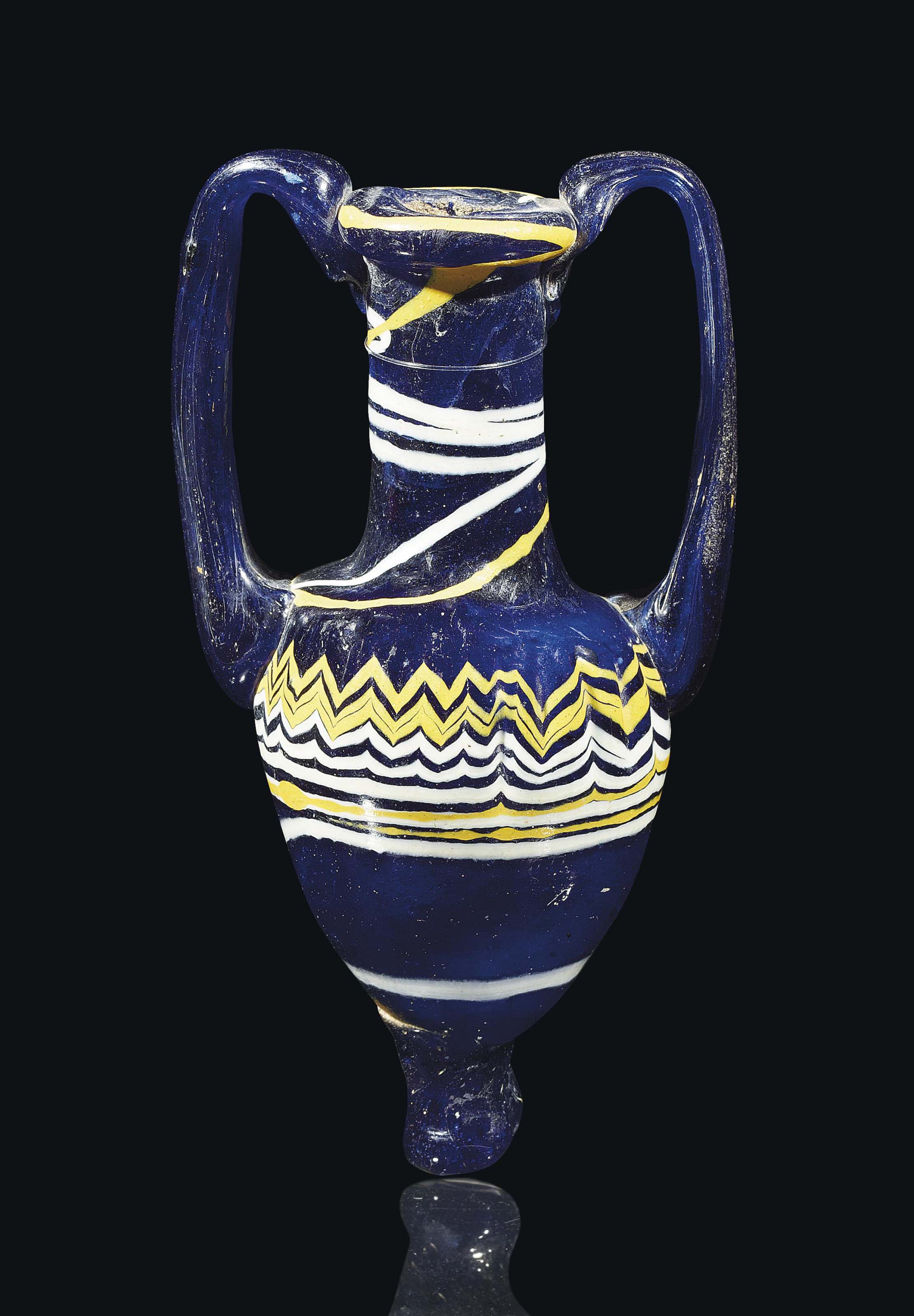 A GREEK GLASS COREFORMED AMPHORISKOS , HELLENISTIC PERIOD, CIRCA 3RD