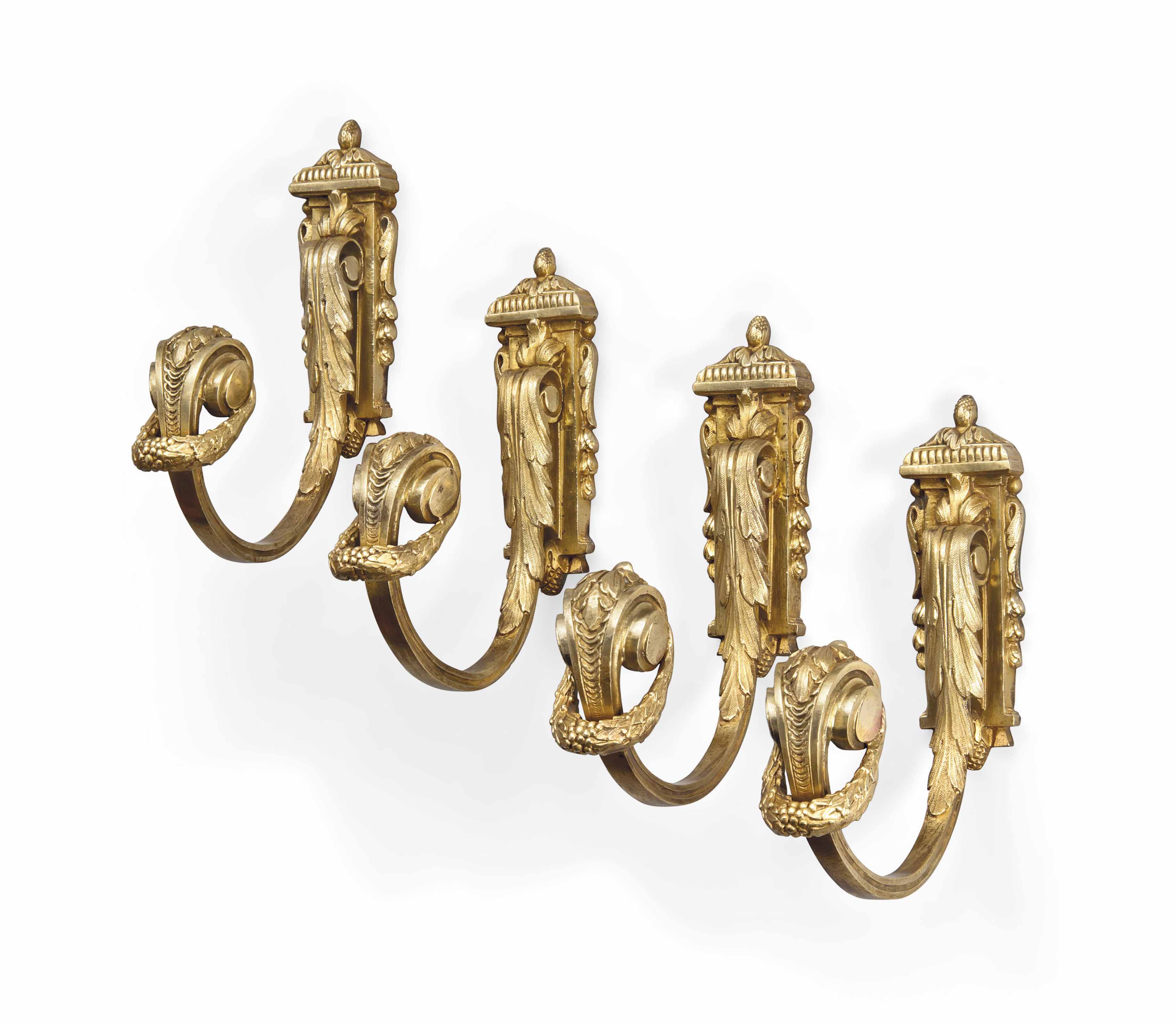 FOUR FRENCH GILTBRONZE CURTAIN TIE BACKS