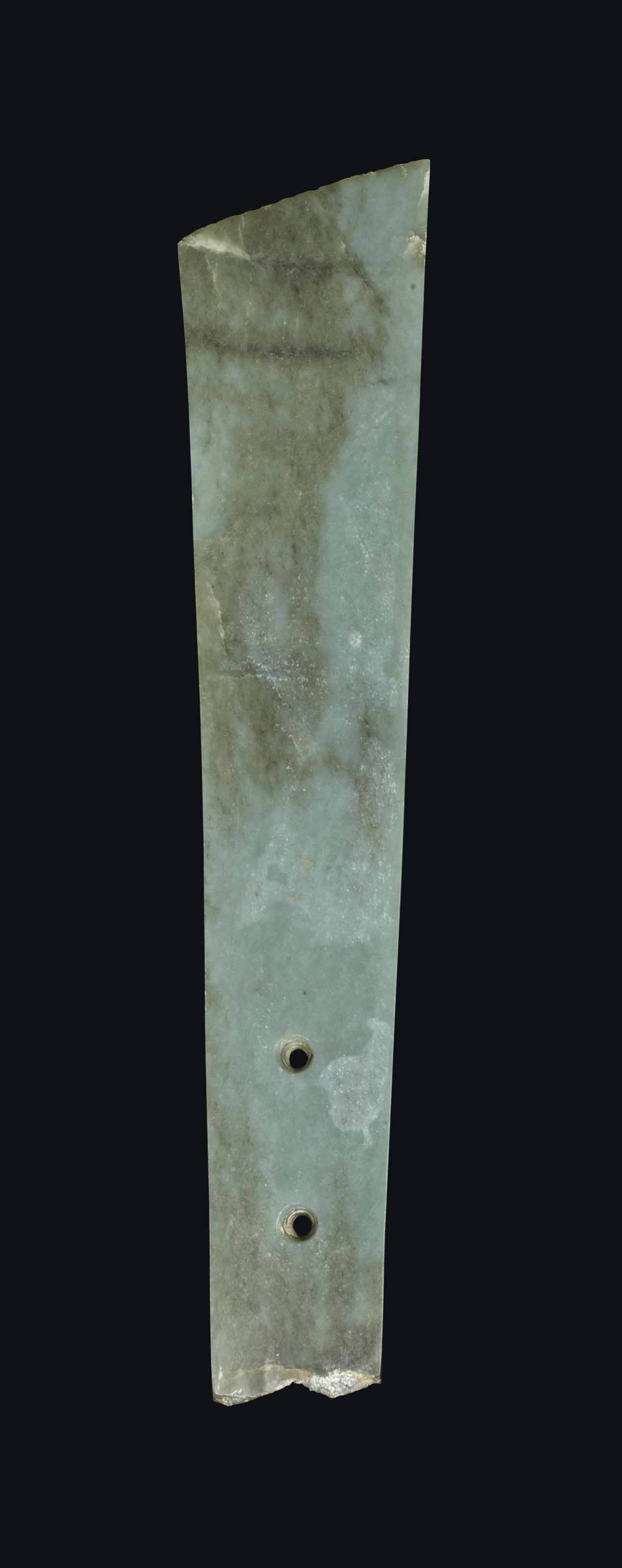 A CHINESE GREEN AND RUSSET JADE BLADE, GUI , WESTERN ZHOU DYNASTY (1100