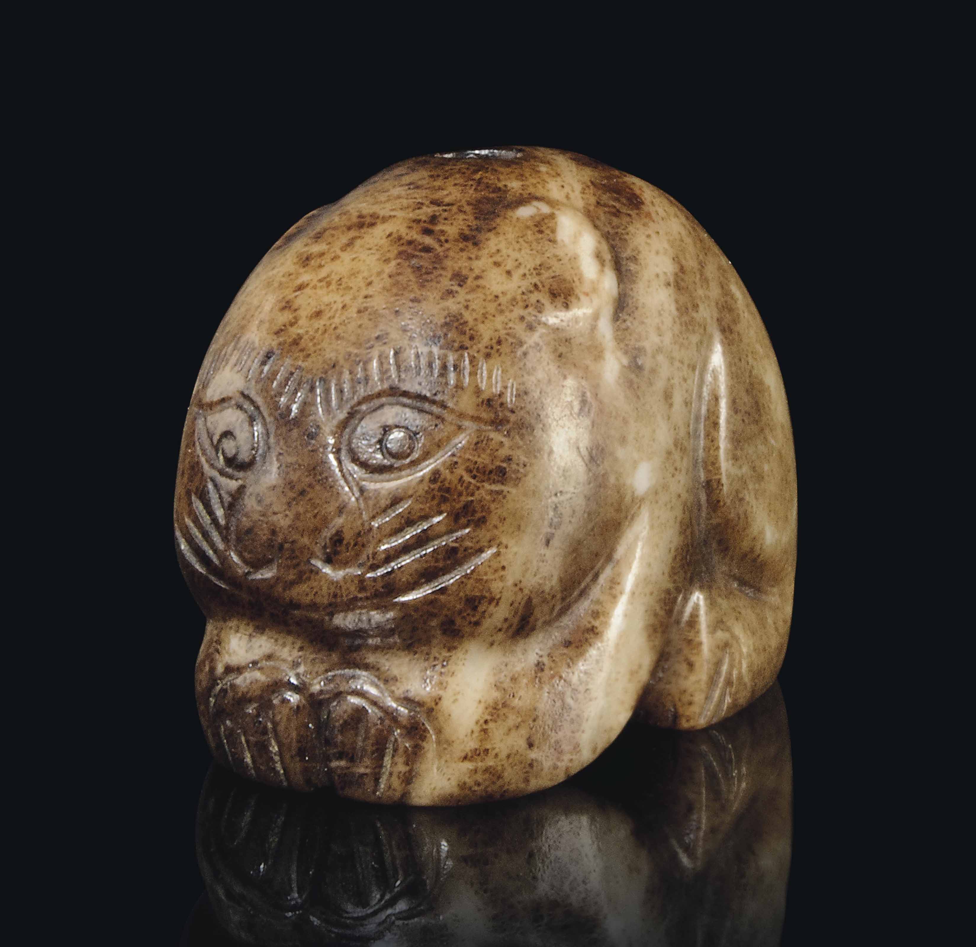 A CHINESE JADE CARVING OF A CAT , MING DYNASTY (13681644) OR LATER