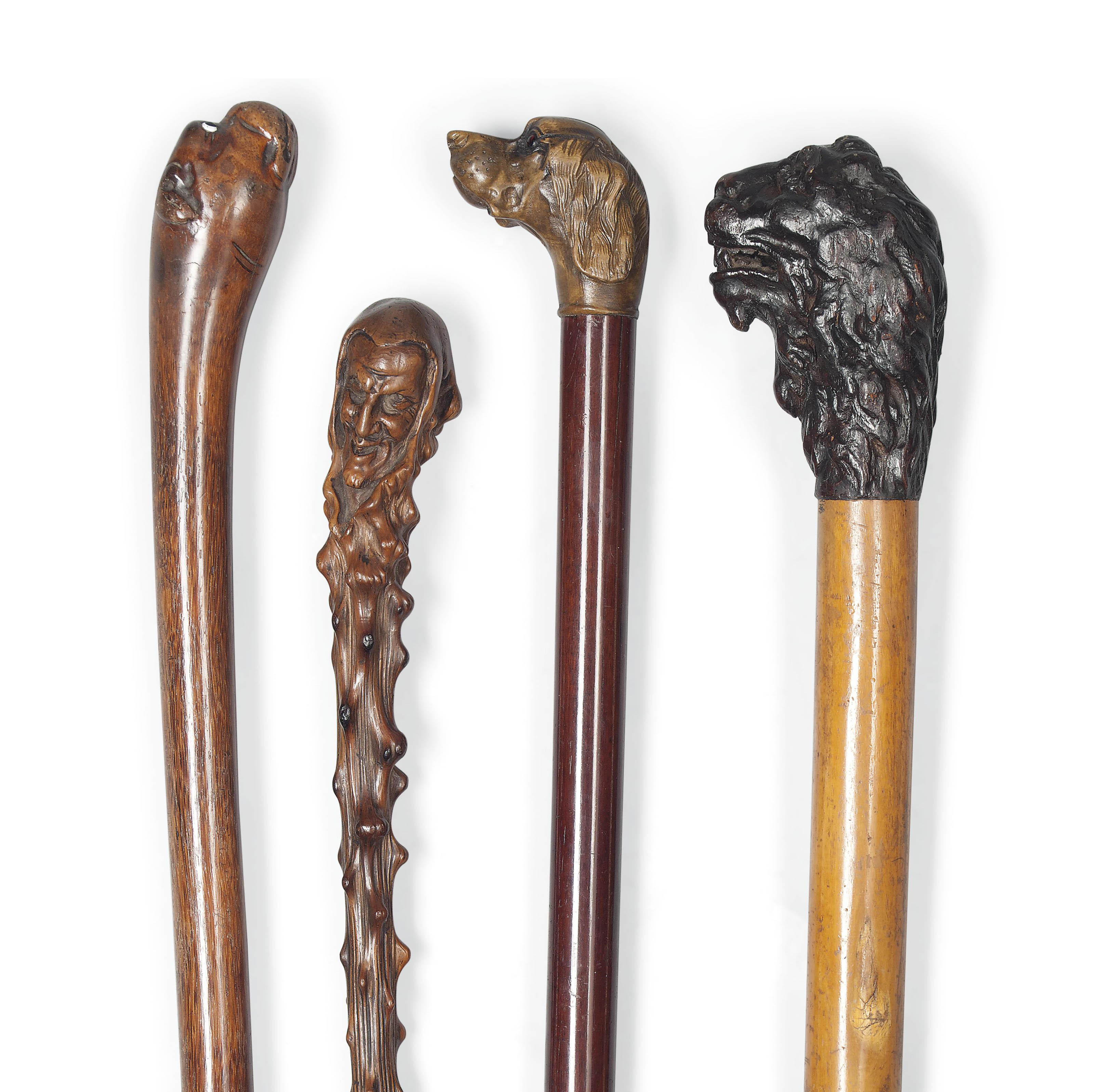 FOUR CARVED-WOOD NOVELTY WALKING STICKS , LATE 19TH EARLY 20TH CENTURY