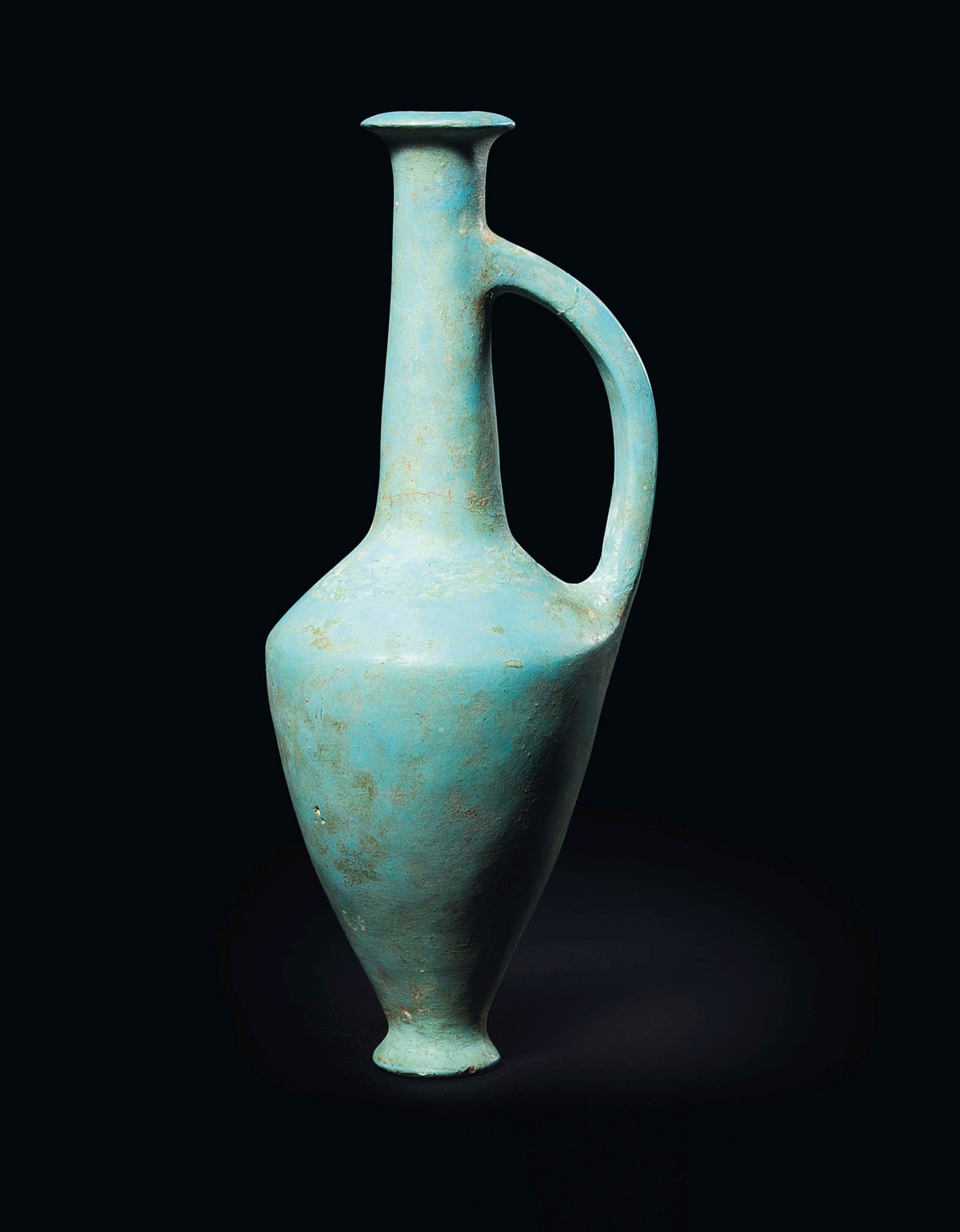 AN EGYPTIAN TURQUOISE GLASSY FAIENCE FLASK