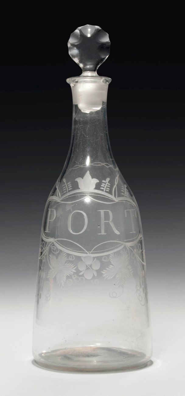 AN ENGRAVED GLASS PORT DECANTER AND STOPPER