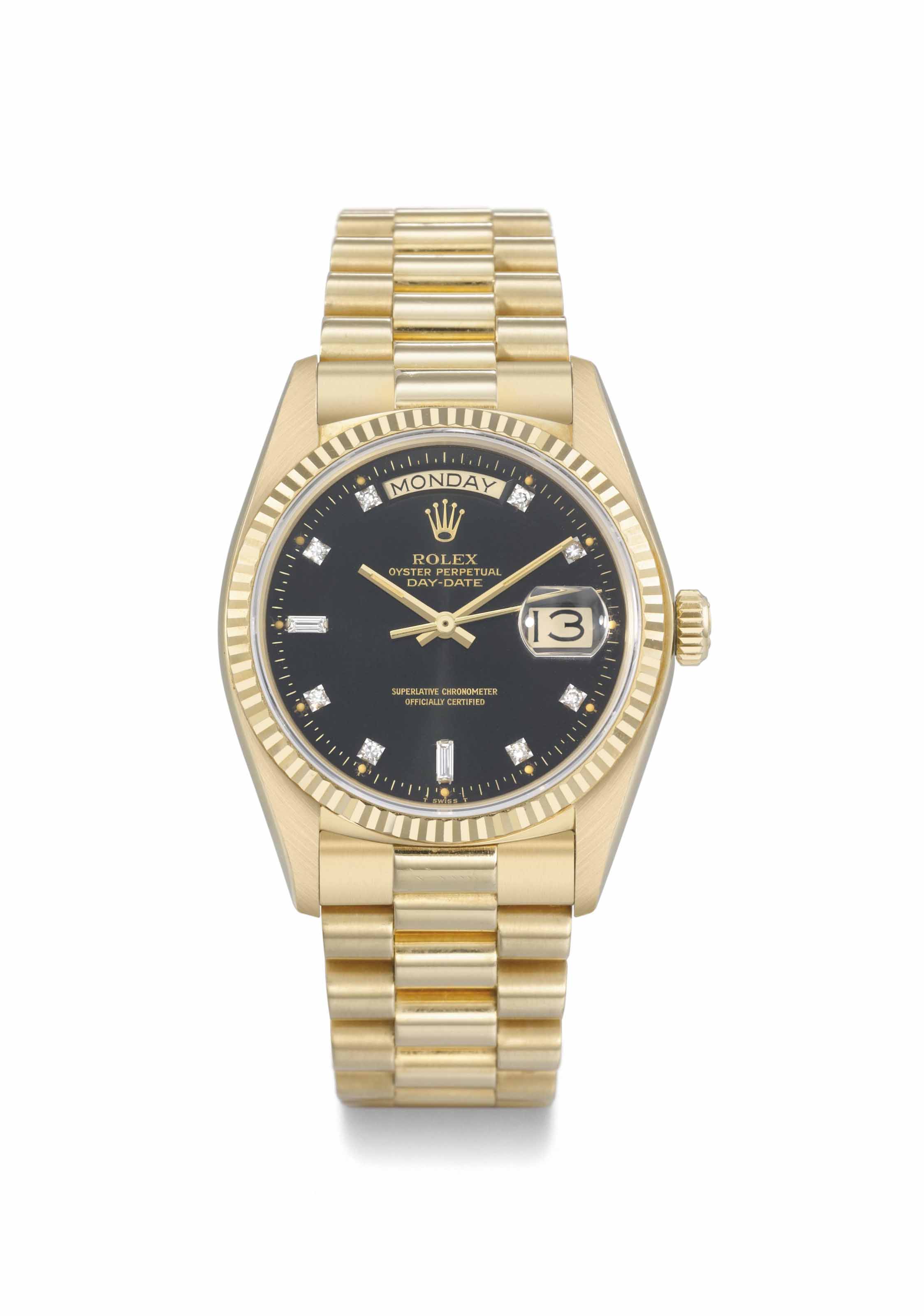 Rolex. An attractive 18K gold automatic calendar wristwatch with sweep