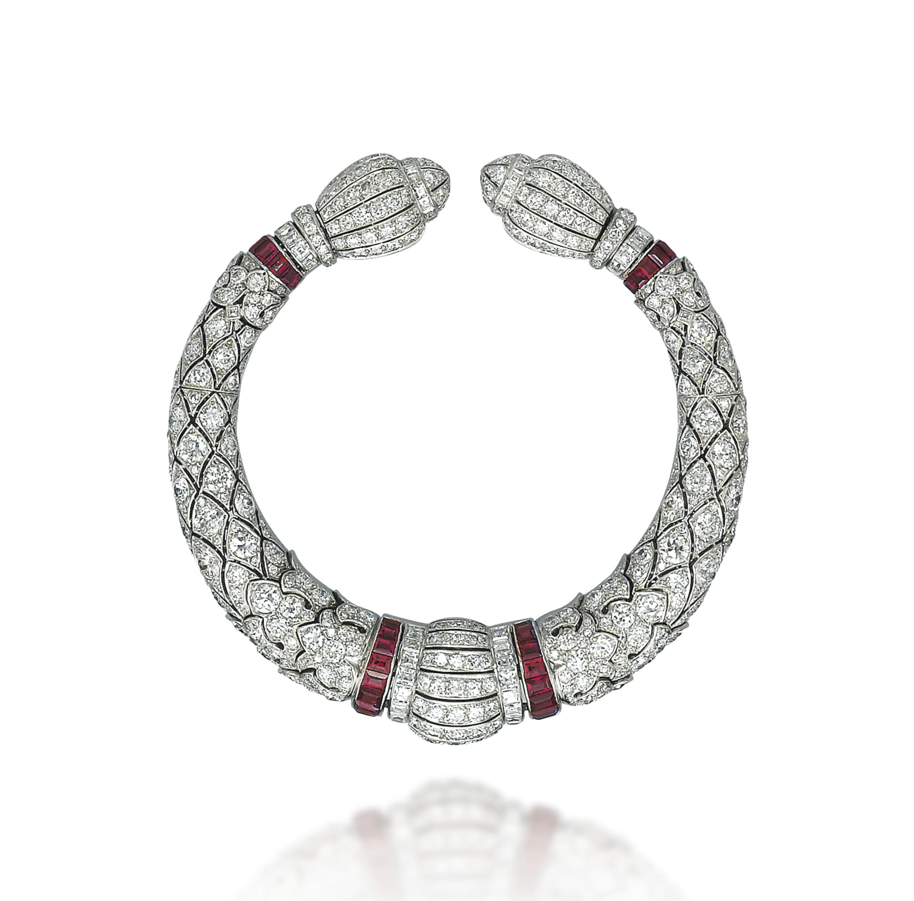 AN ART DECO RUBY AND DIAMOND BANGLE, BY LACLOCHE