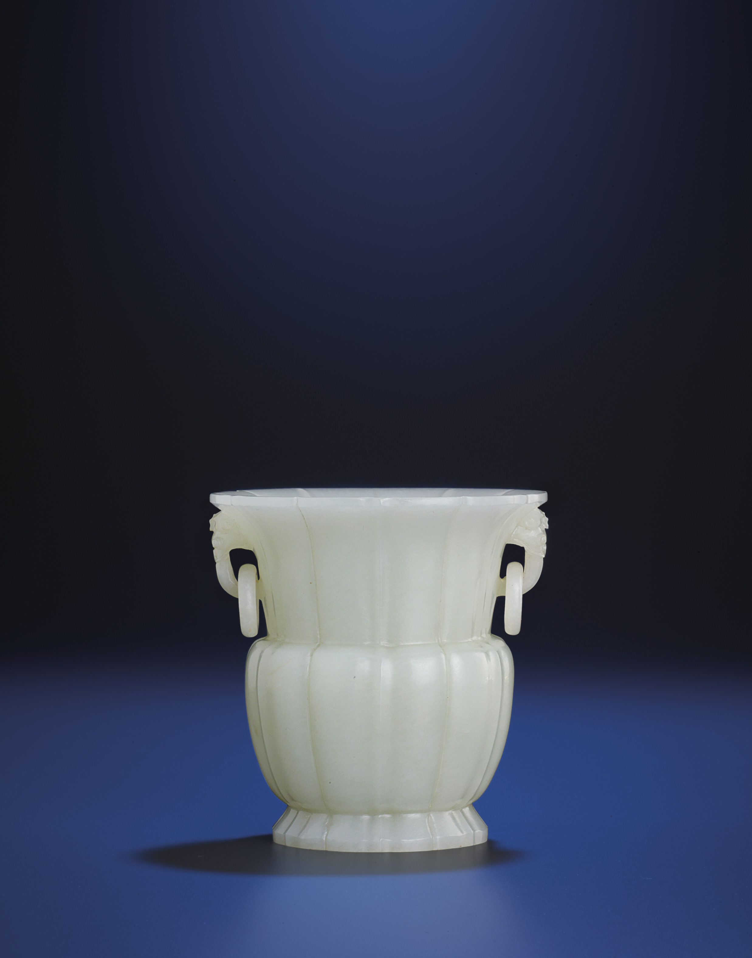 A FINE AND RARE WHITE JADE FLUTED VASE , QIANLONG PERIOD (17361795