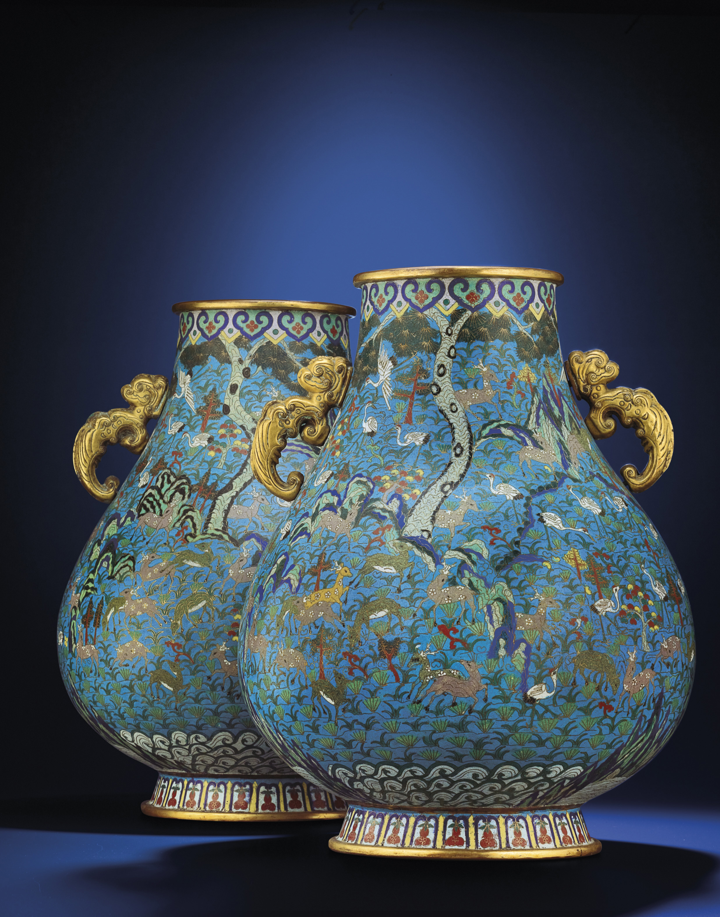A LARGE PAIR OF CLOISONNE ENAMEL 'HUNDRED DEER' VASES, ZUN , QIANLONG
