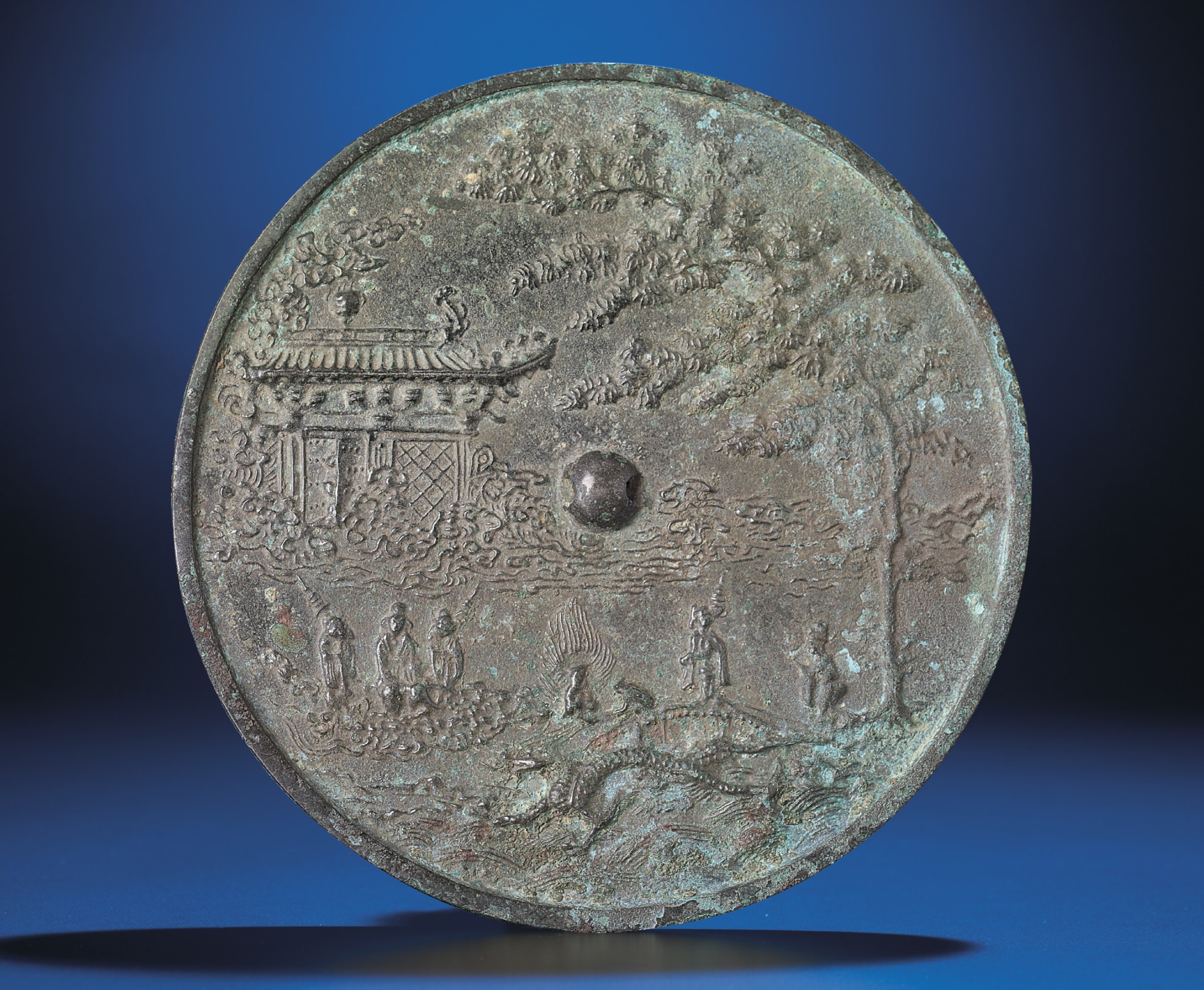 A RARE BRONZE 'CELESTIAL' MIRROR