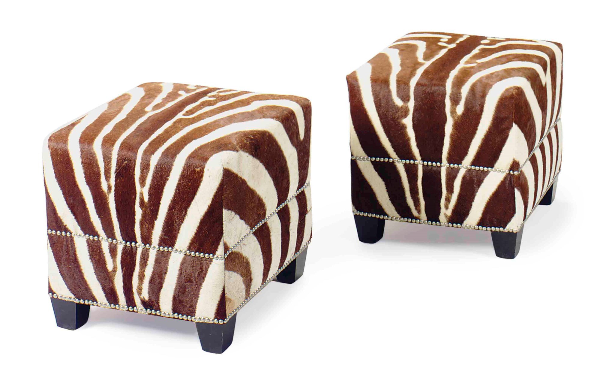 A PAIR OF ZEBRA HIDE COVERED STOOLS,
