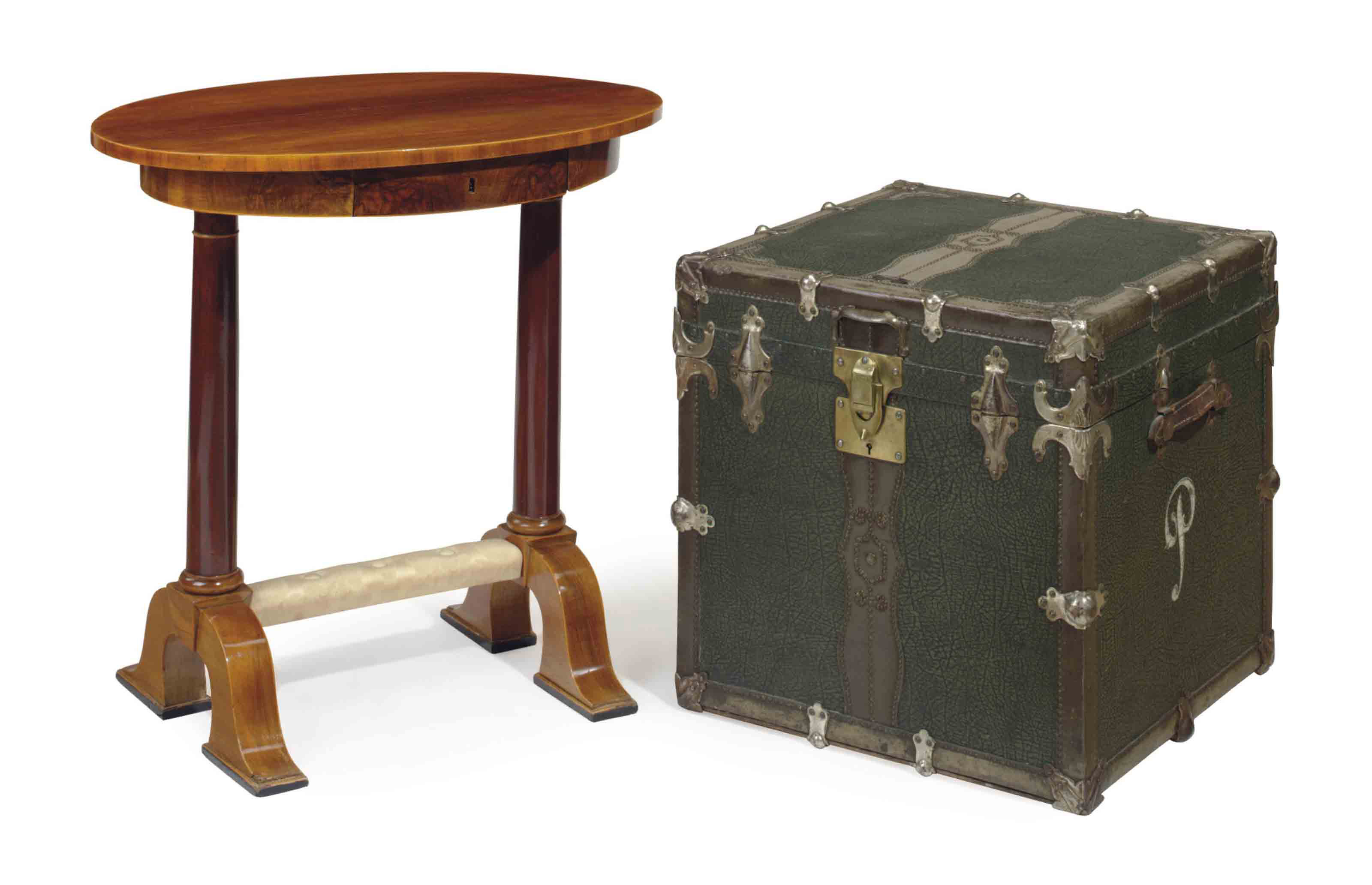 A Mahogany Oval Table And A Green Leather And Metal Steamer Trunk