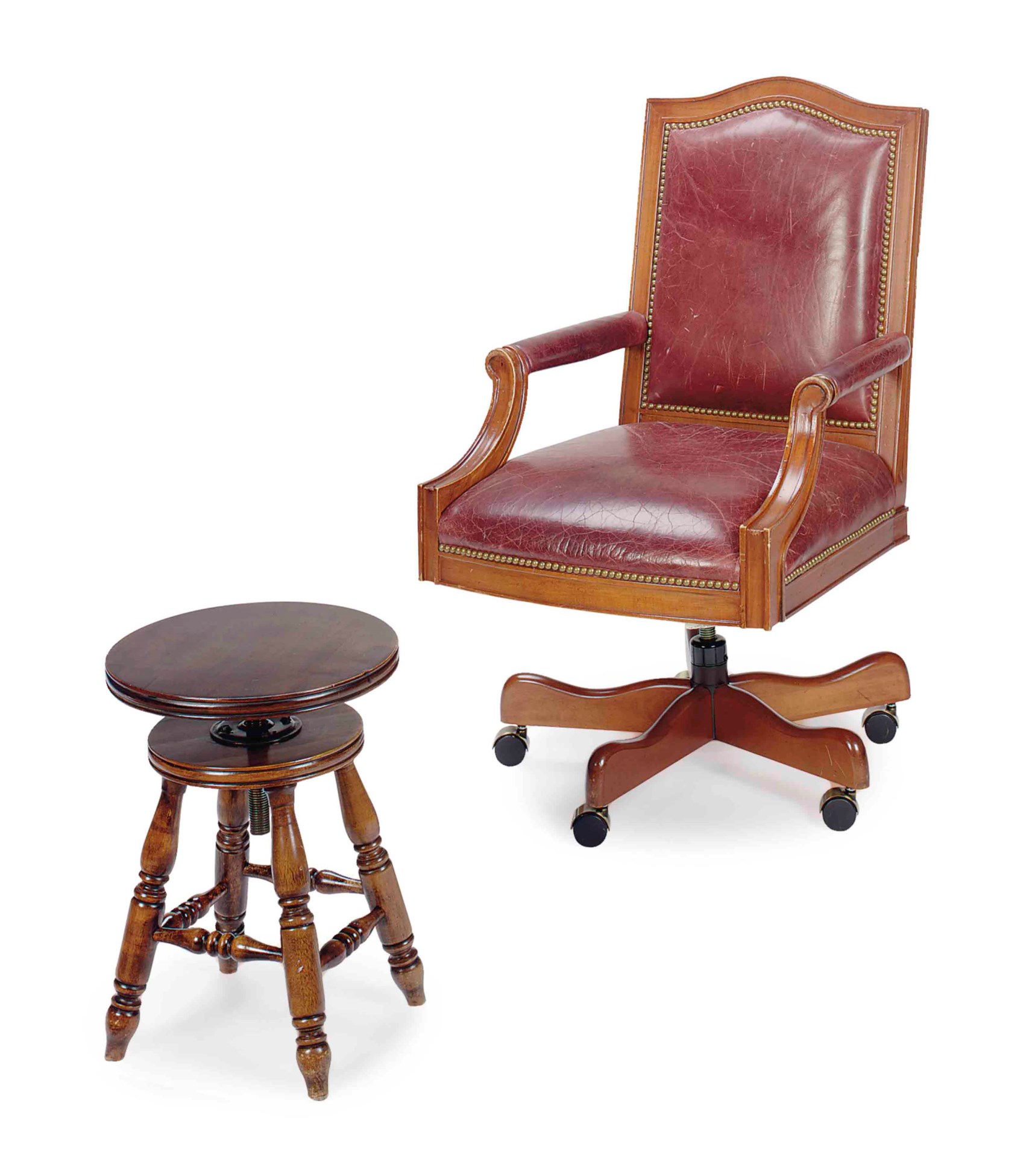 A MAHOGANY AND LEATHER UPHOLSTERED ROLLING ARMCHAIR,
