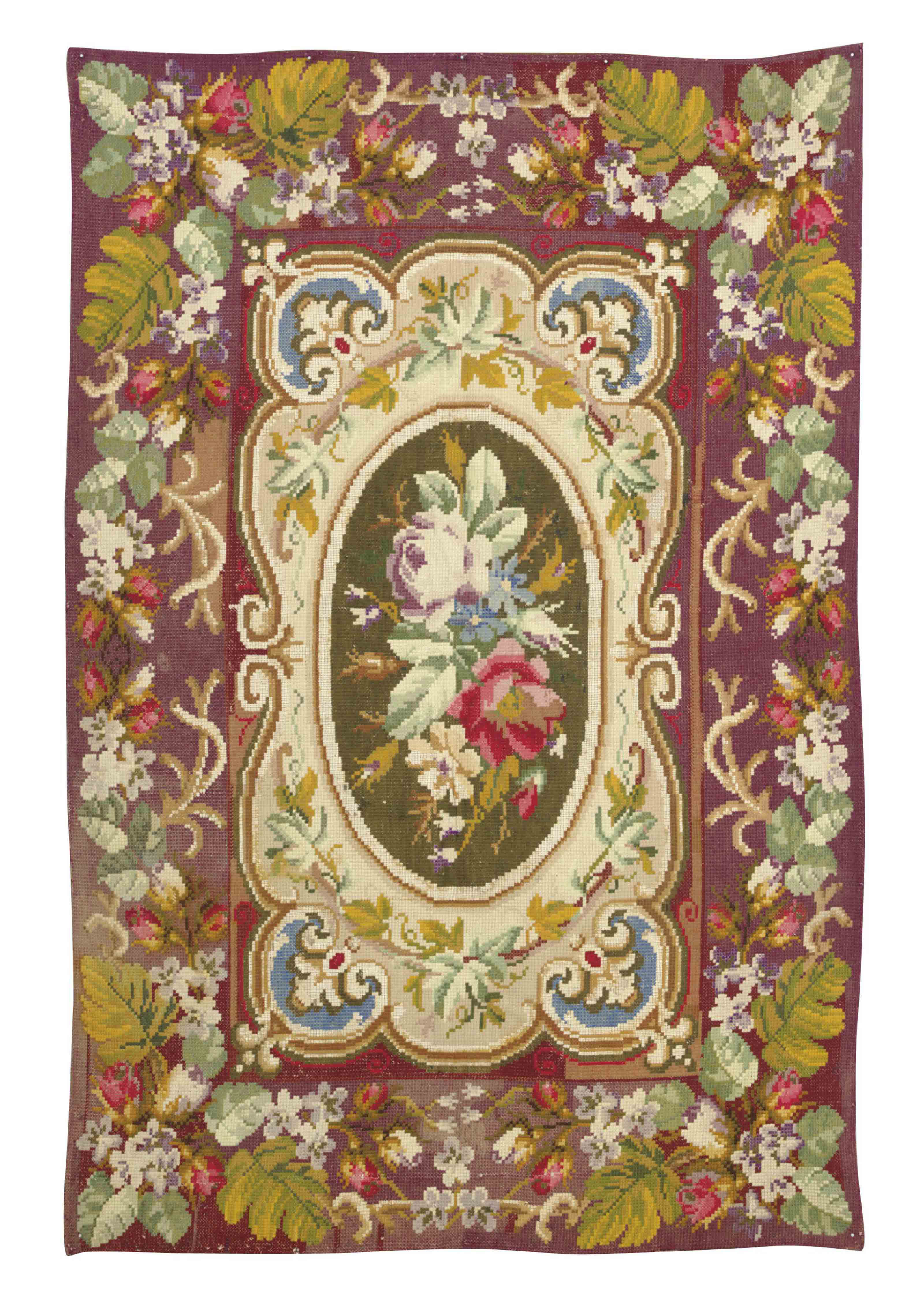 A VICTORIAN NEEDLEWORK RUG,