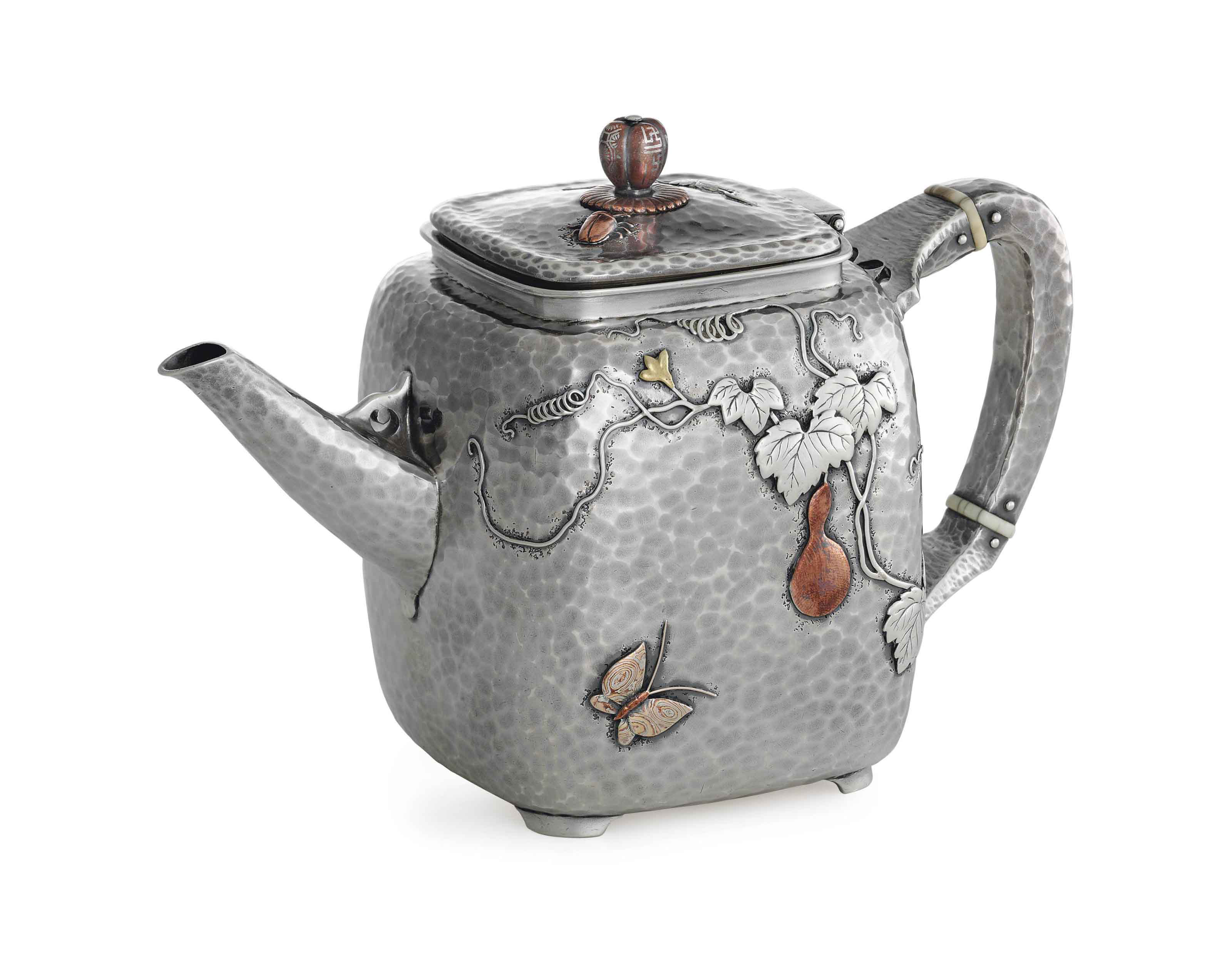 A FINE SILVER AND MIXEDMETAL TEAPOT , MARK OF TIFFANY & CO., NEW YORK