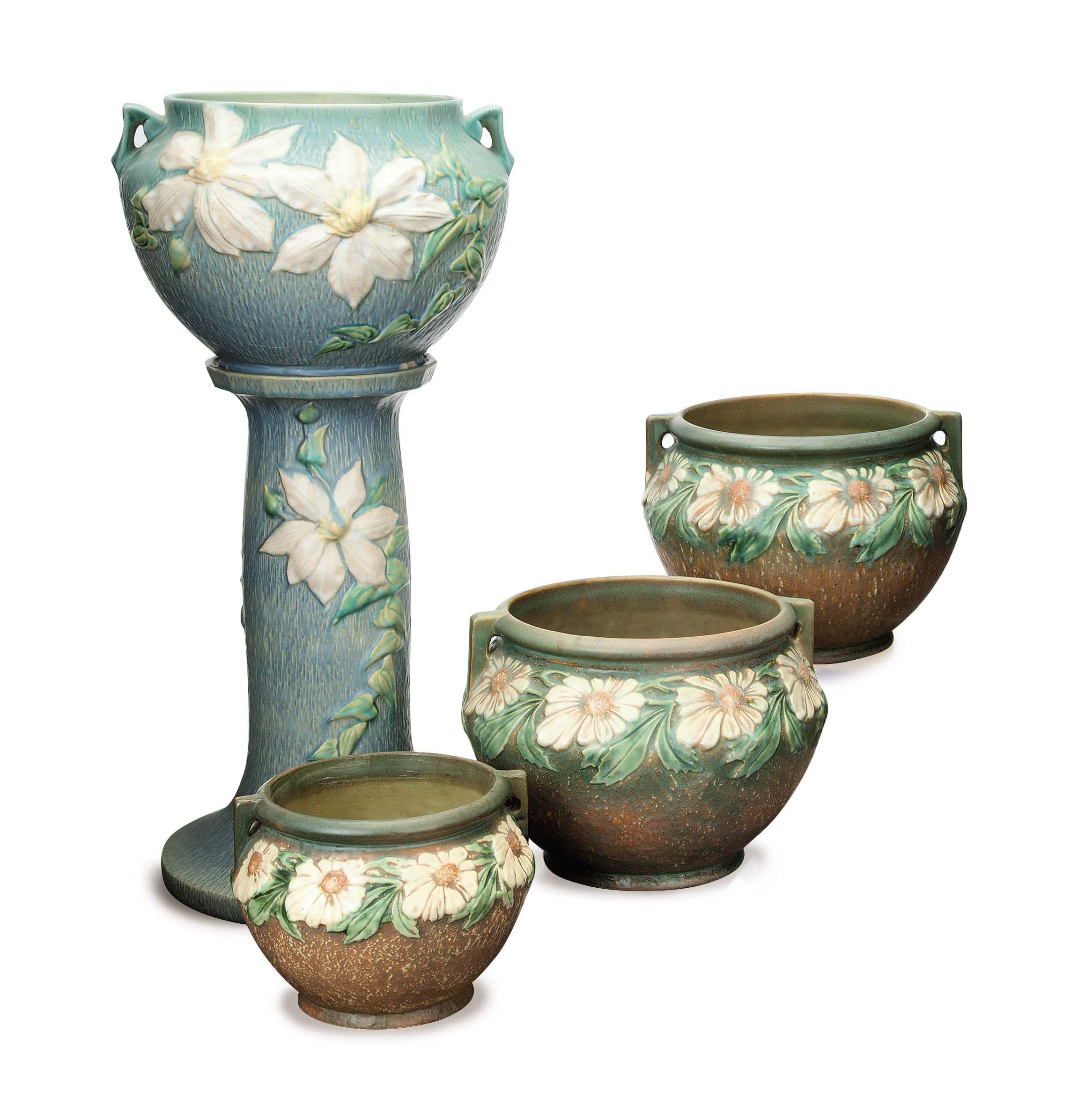An American Pale Blue Glazed Flower Pot And Stand And Three Similar Brown Glazed Earthenware Flower