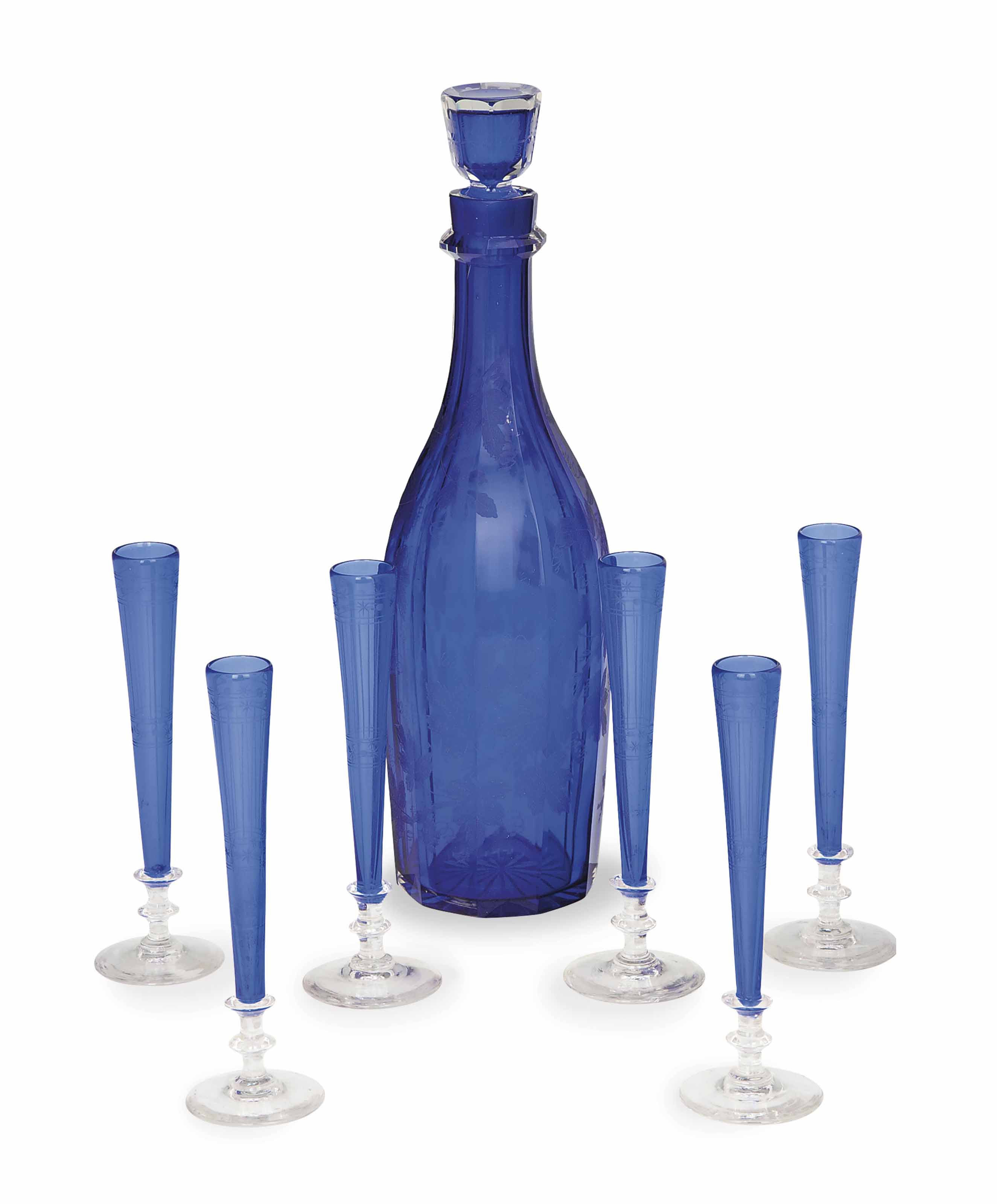 AN ENGLISH ETCHED COBALTBLUE GLASS DECANTER AND STOPPER, AND SIX