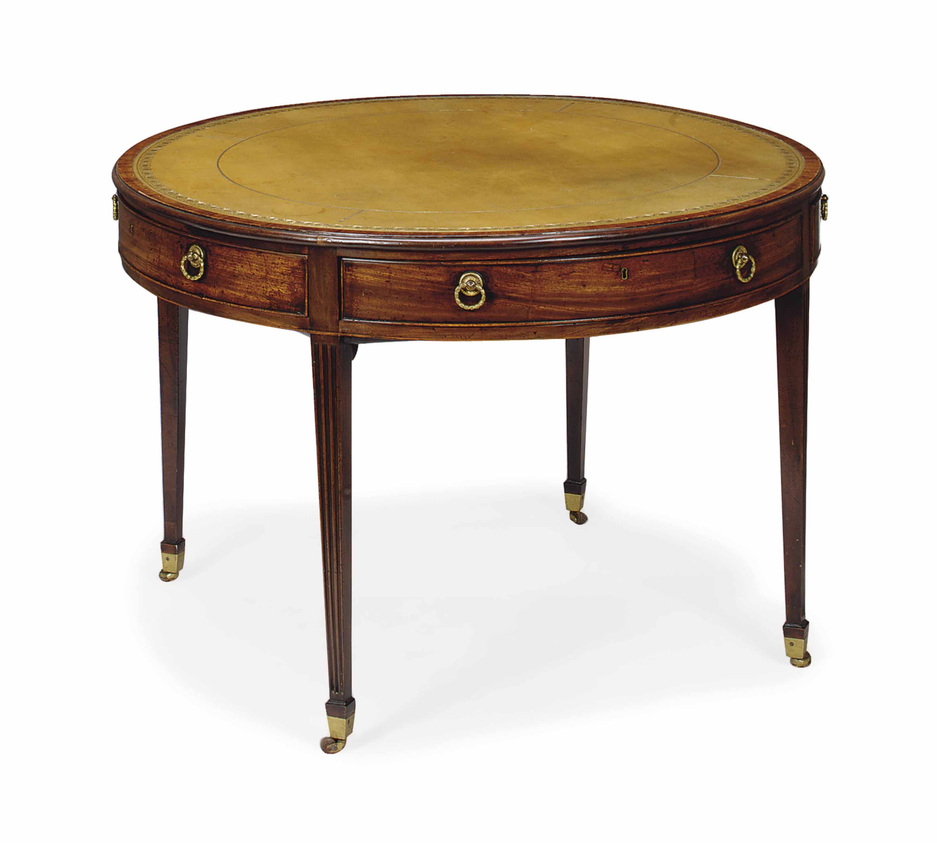 AN ENGLISH MAHOGANY AND INSET LEATHERTOP CIRCULAR LIBRARY TABLE
