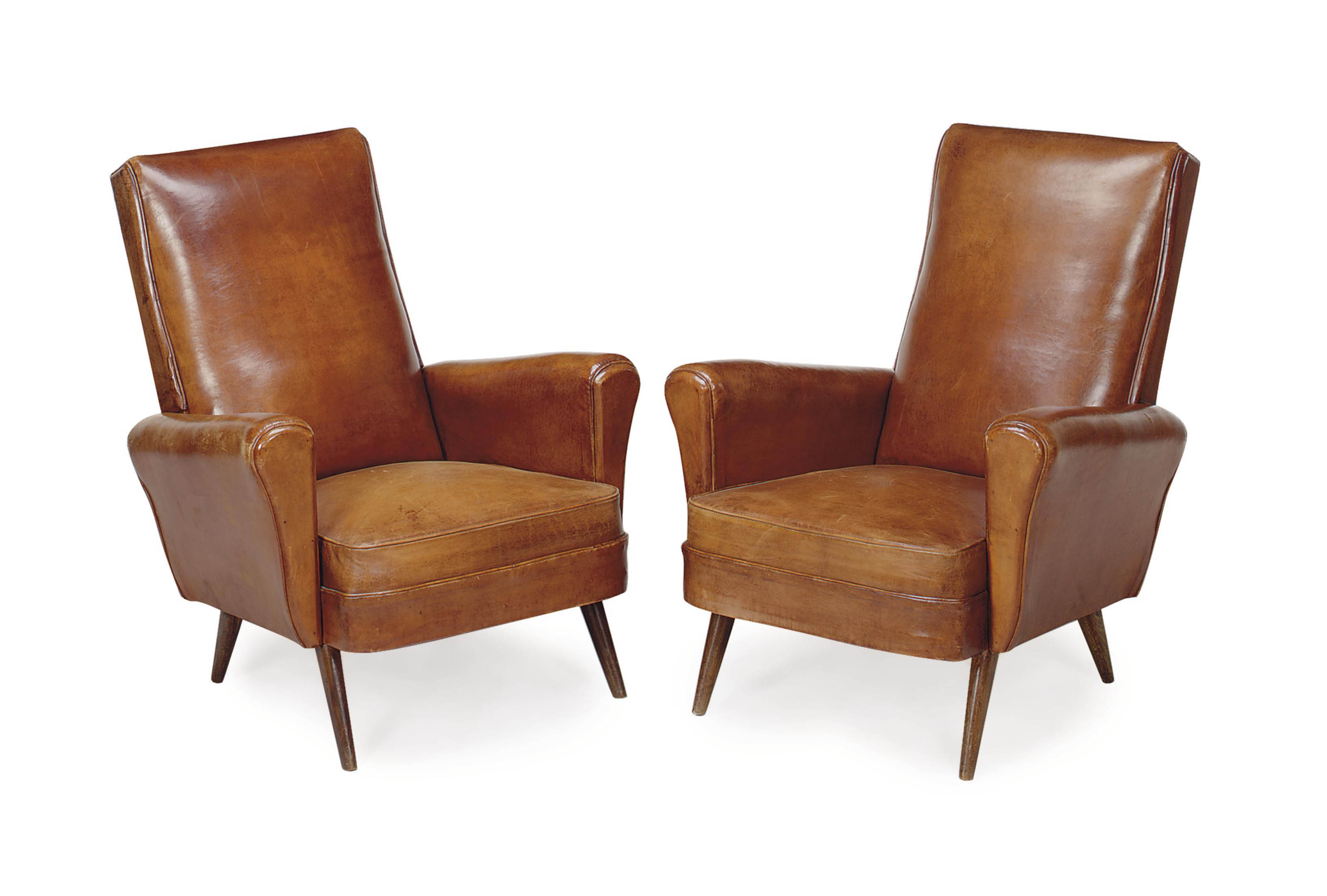 A PAIR OF BROWN LEATHERUPHOLSTERED ARMCHAIRS,