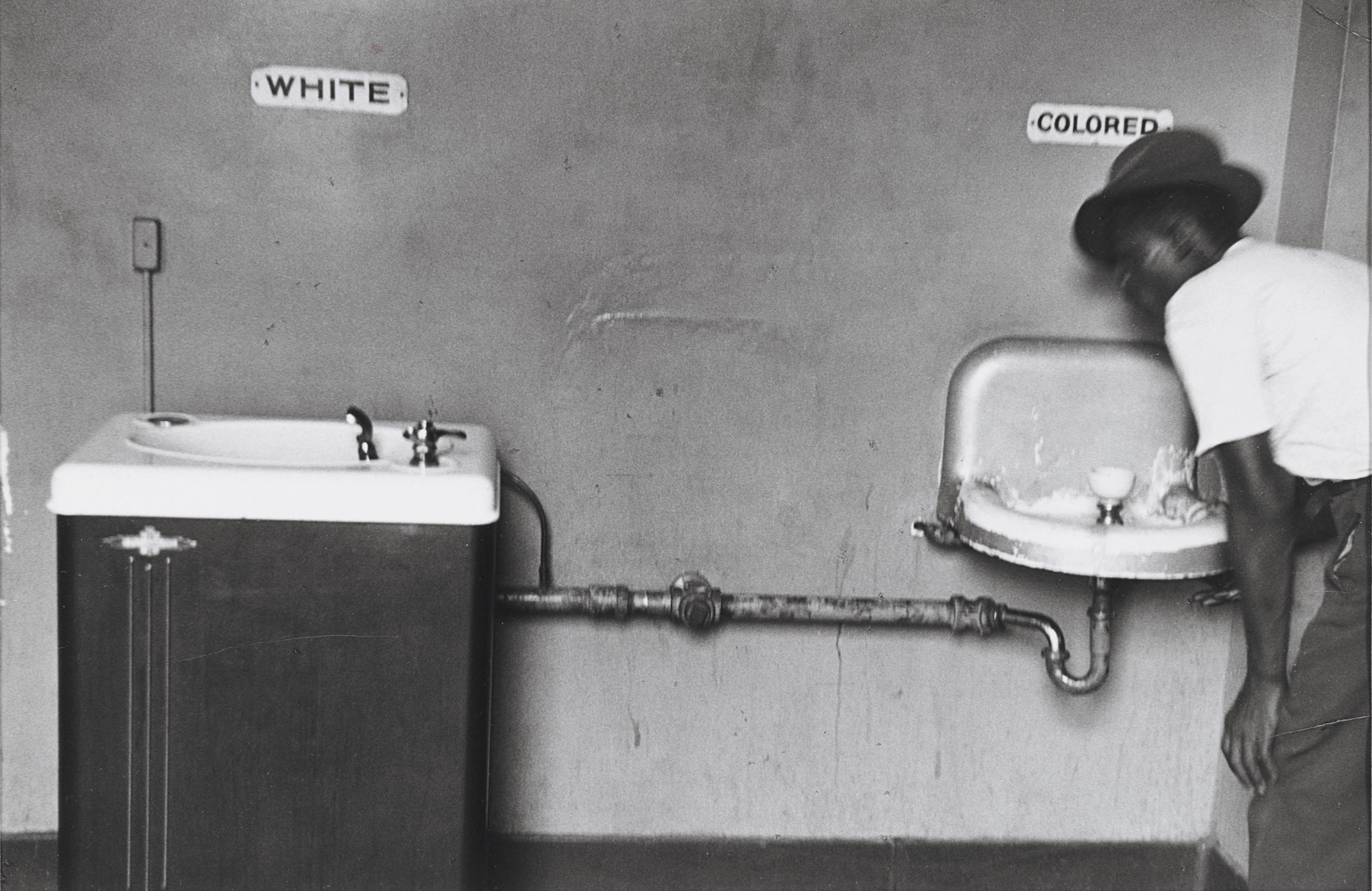 ELLIOTT ERWITT (B. 1928) , Segregated Water Fountains, North Carolina