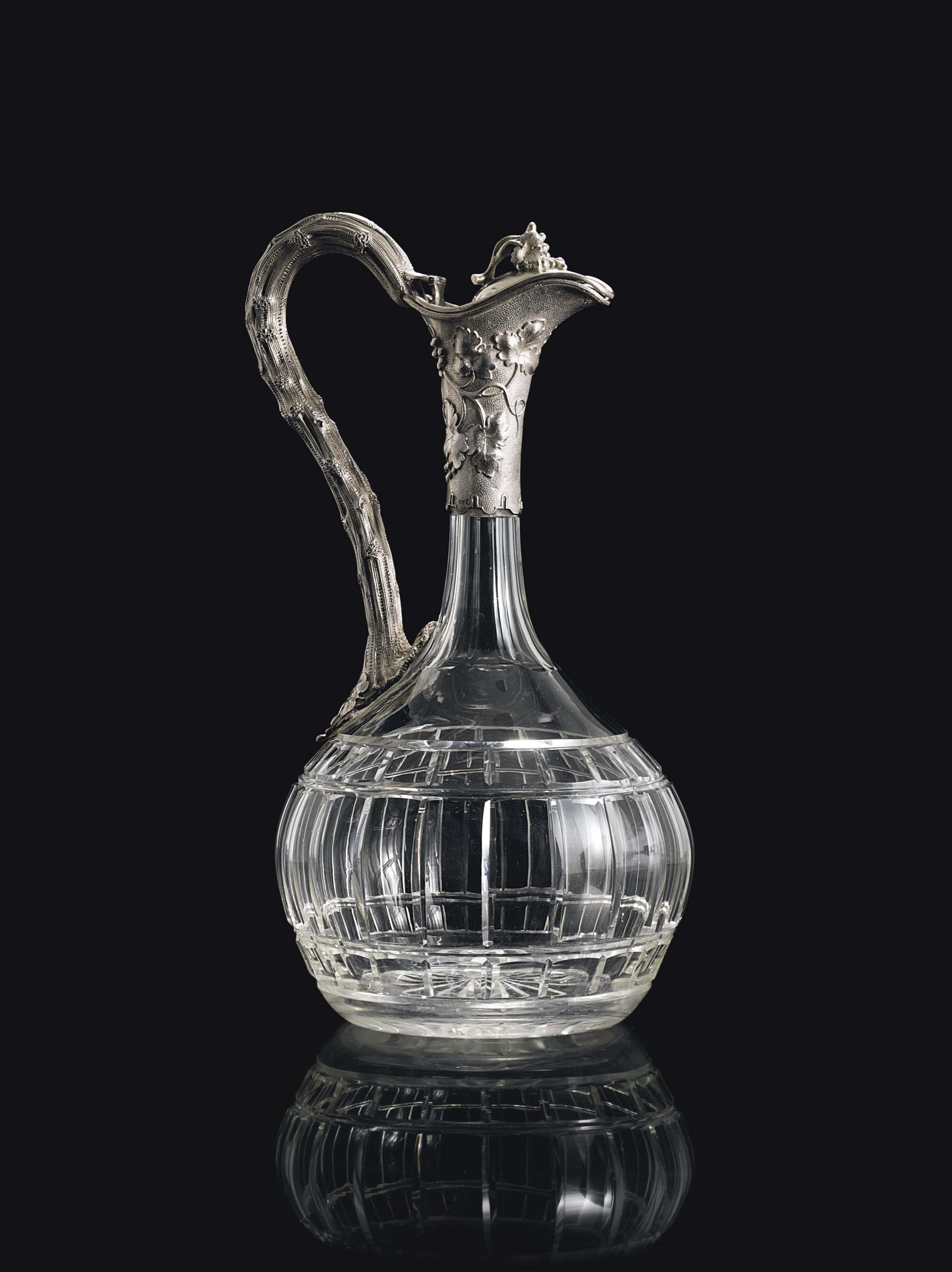 A SILVERMOUNTED CUTGLASS DECANTER , MAKER'S MARK INDISTINCT, POSSIBLY