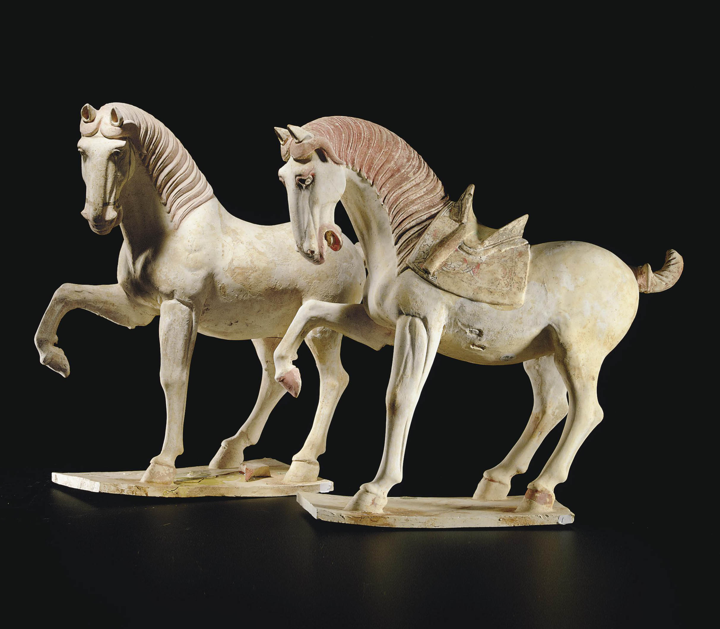 A PAIR OF PAINTED POTTERY FIGURES OF HORSES , TANG DYNASTY (618907