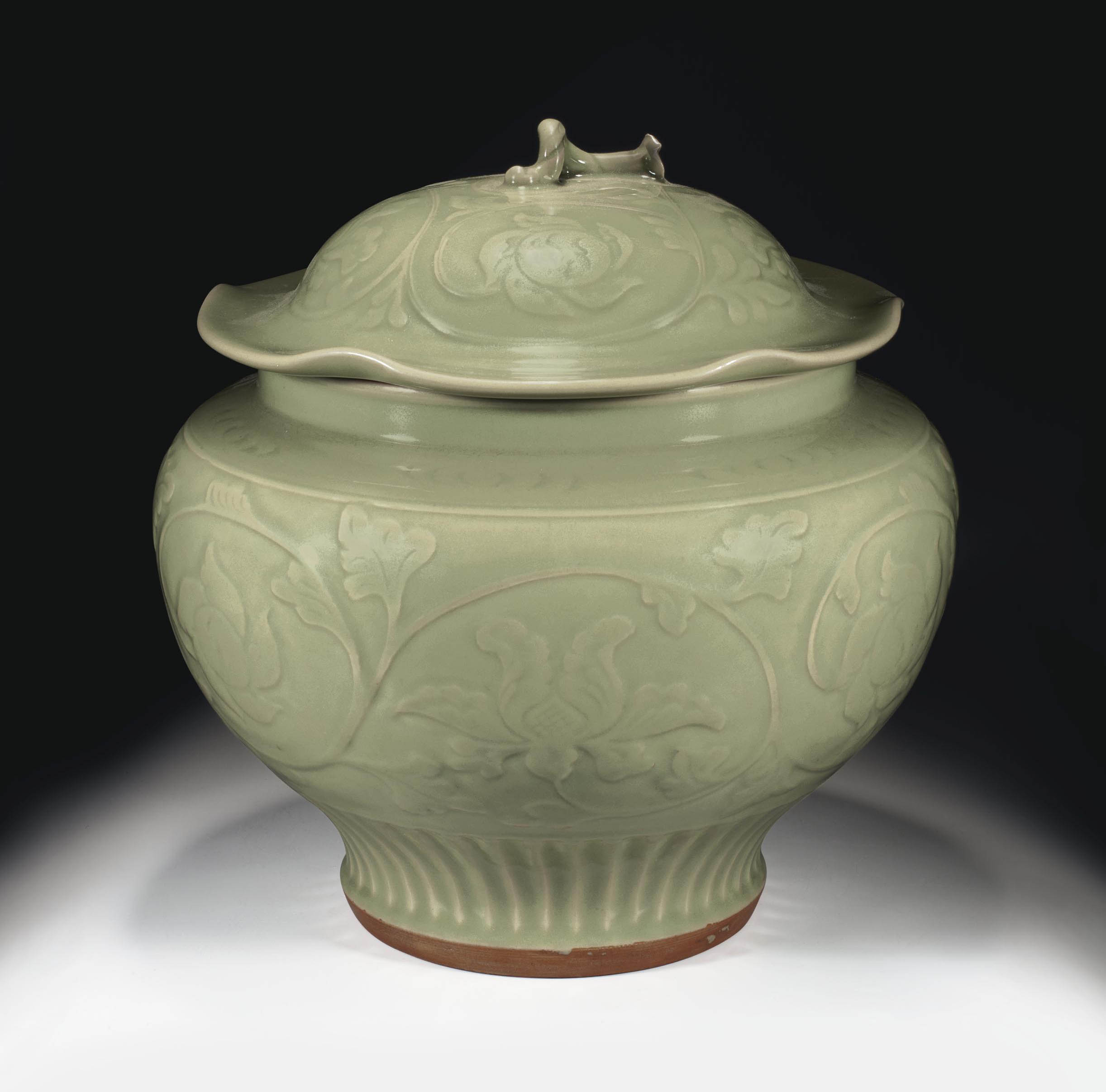 A CARVED LONGQUAN CELADON JAR AND COVER , YUAN/EARLY MING DYNASTY, 14TH