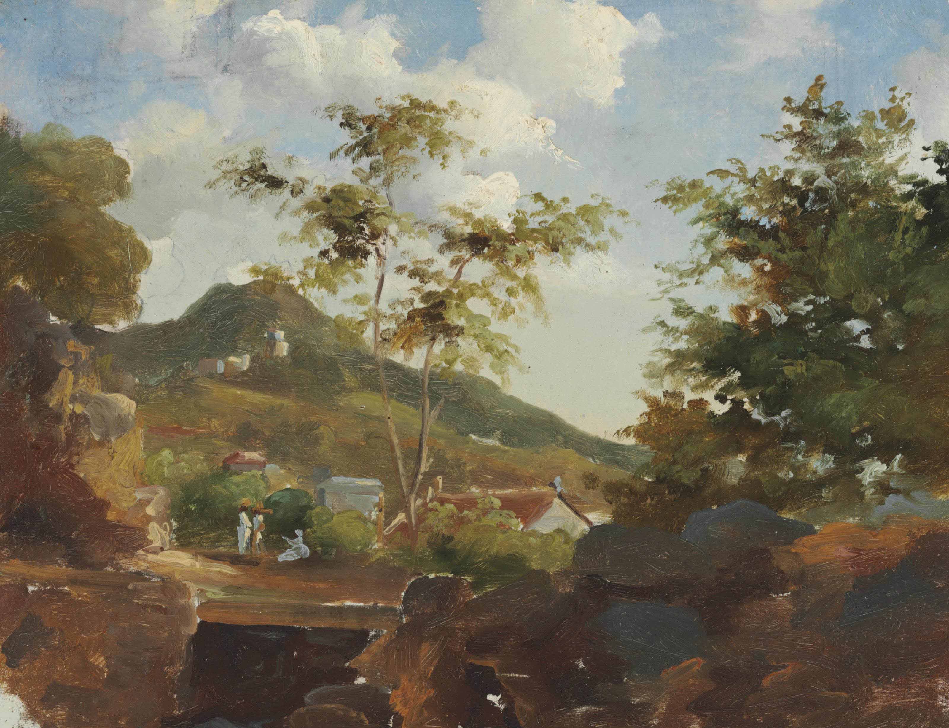 Village au pied d'une colline 

