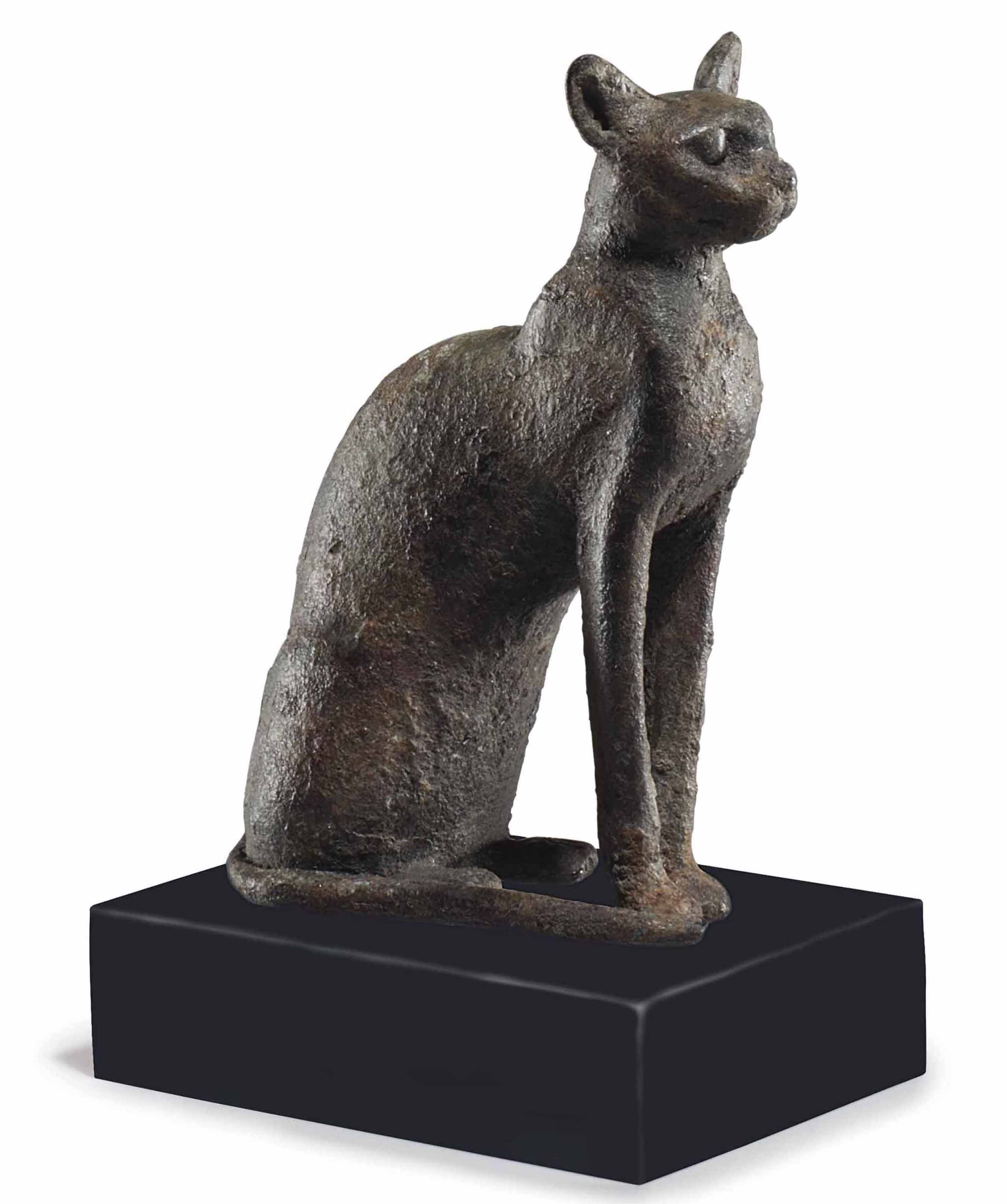 AN EGYPTIAN BRONZE CAT