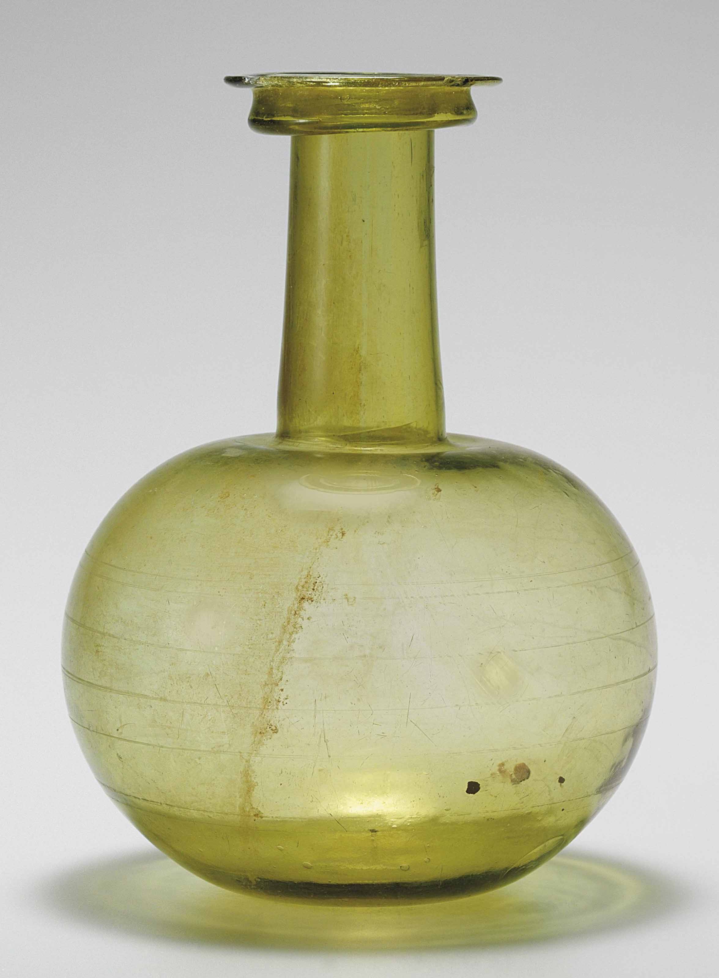 A ROMAN GLASS BOTTLE , CIRCA LATE 1ST2ND CENTURY A.D. Christie's