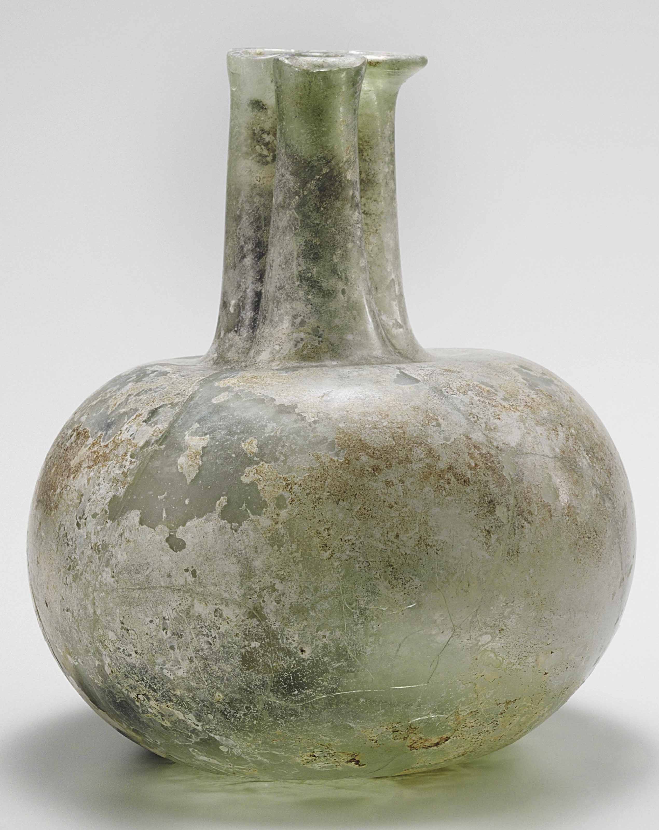 A ROMAN GLASS BOTTLE , CIRCA 2ND3RD CENTURY A.D. Christie's