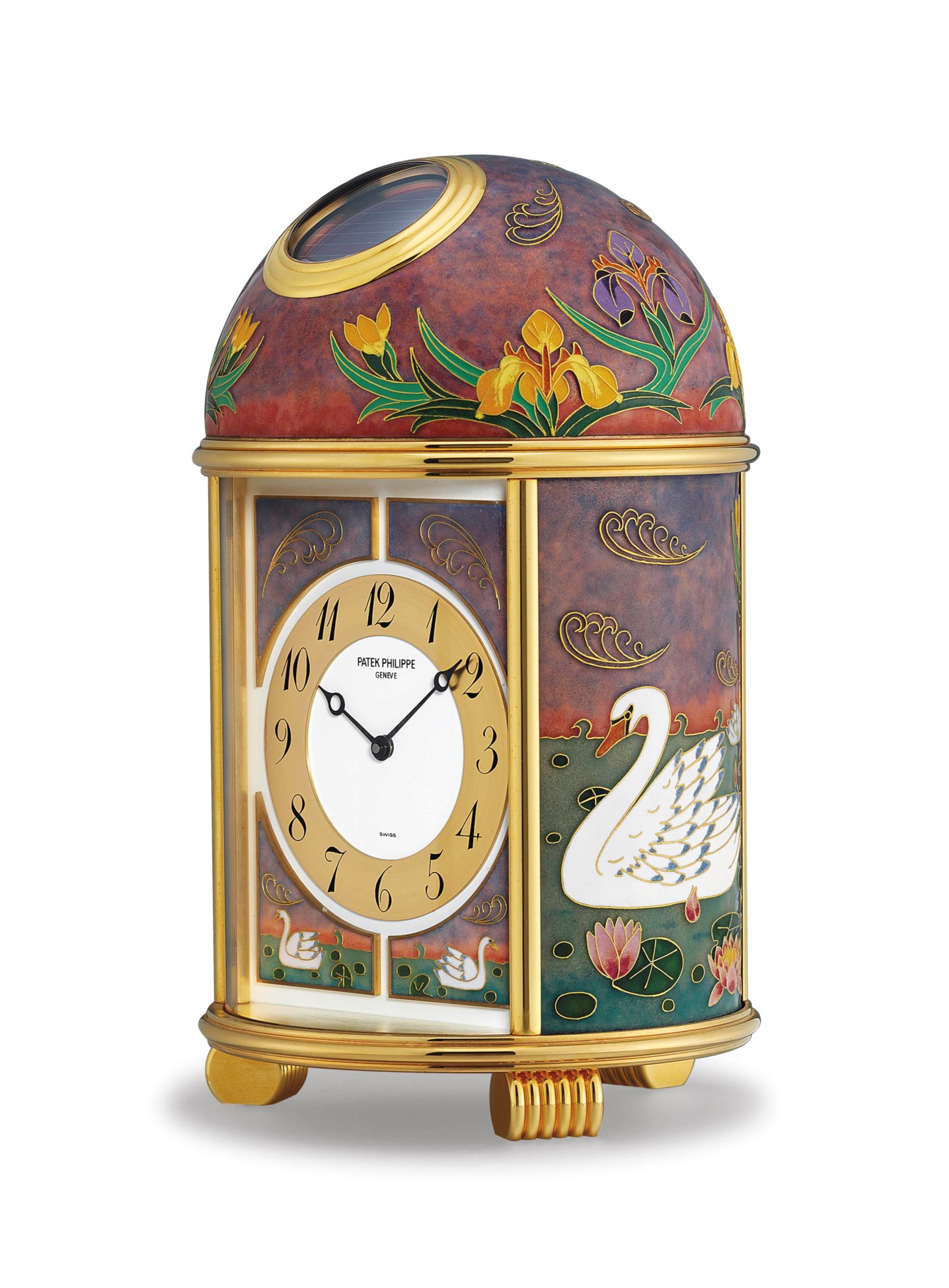 Patek Philippe. A Fine and Unique Gilt Brass SolarPowered Desk Clock