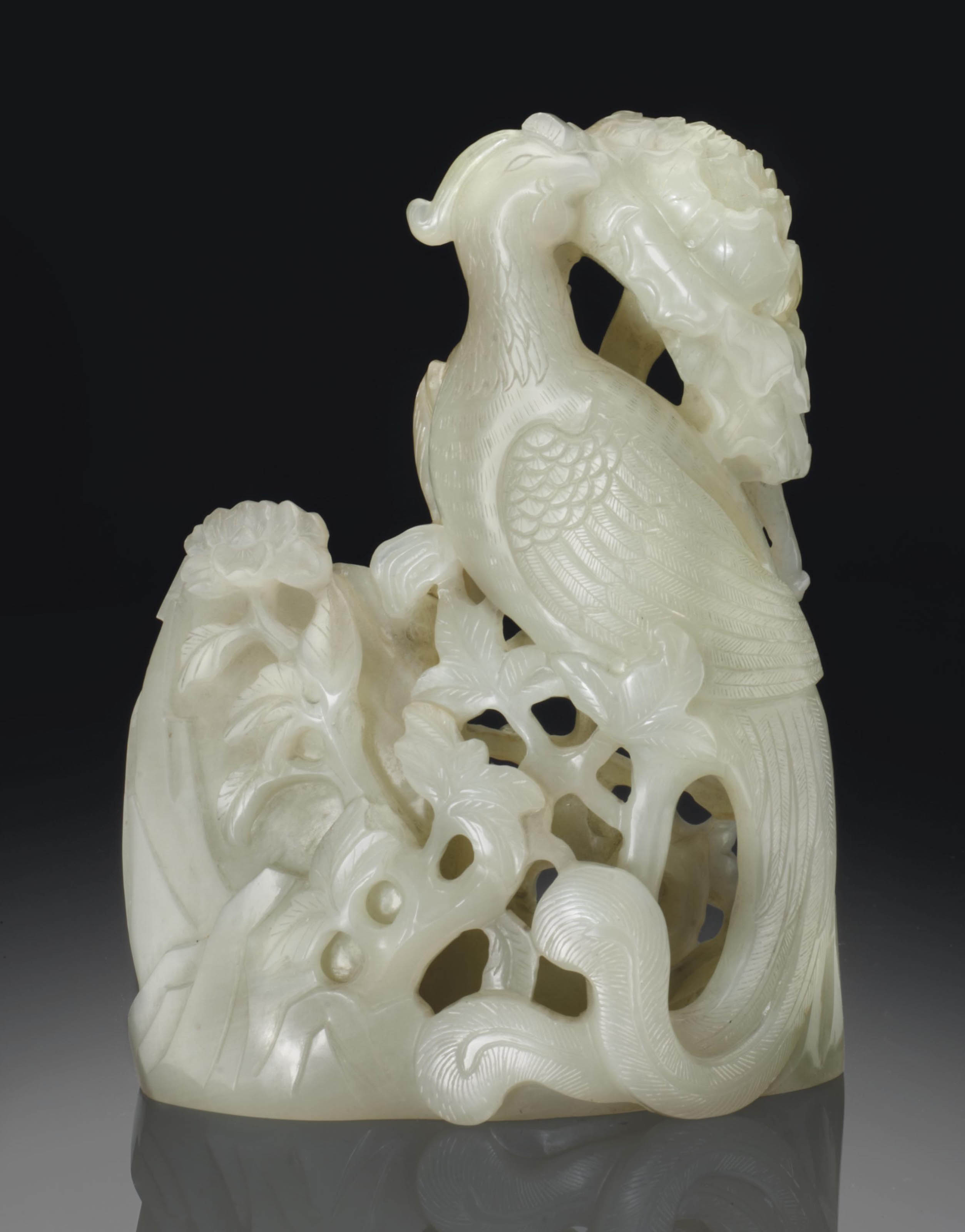 A GREENISHWHITE JADE CARVING OF A PHOENIX WITH WATER POT , 18TH/19TH