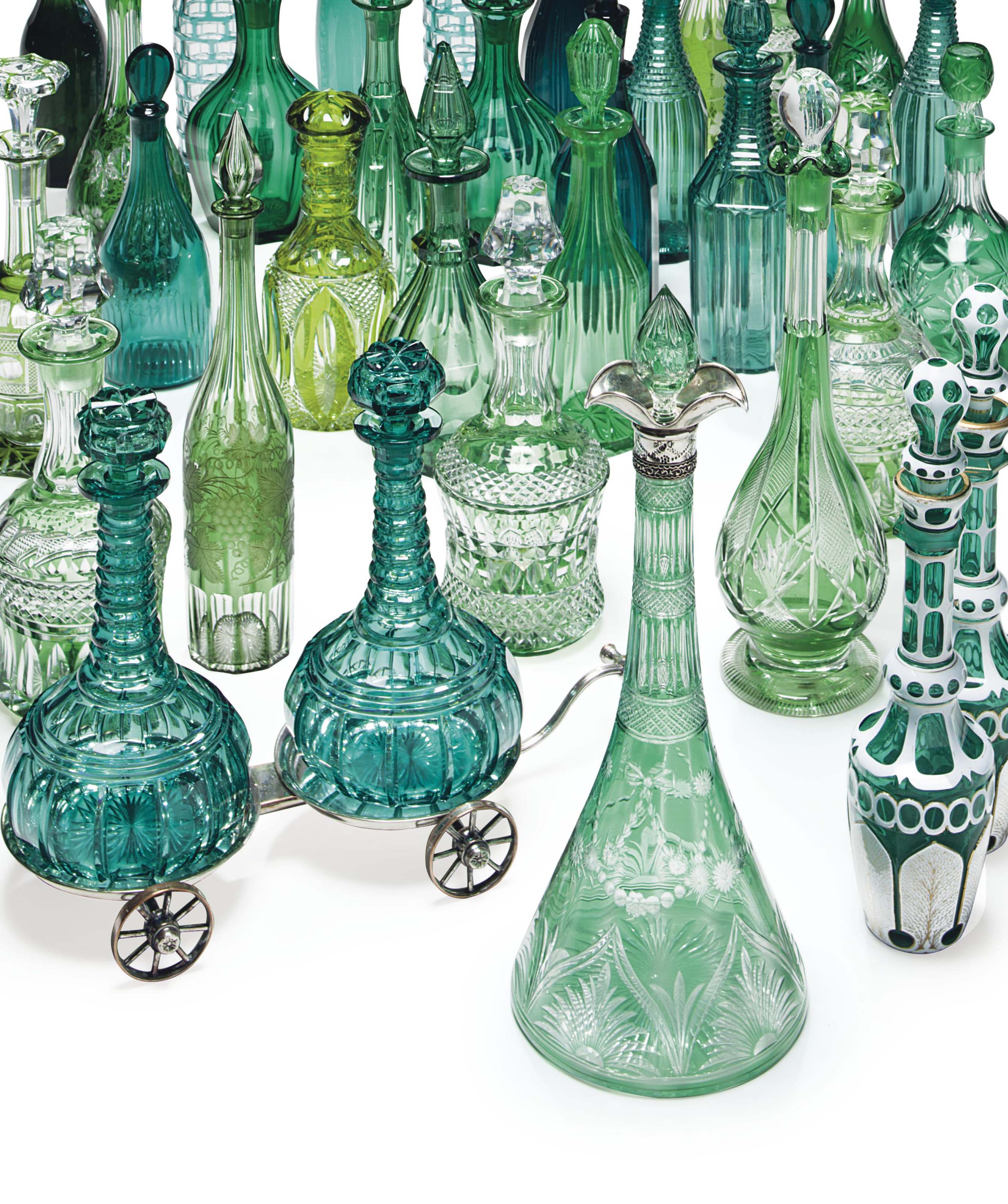 A COLLECTION OF TWENTYTHREE GREEN GLASS DECANTERS , 19TH/20TH CENTURY Christie's
