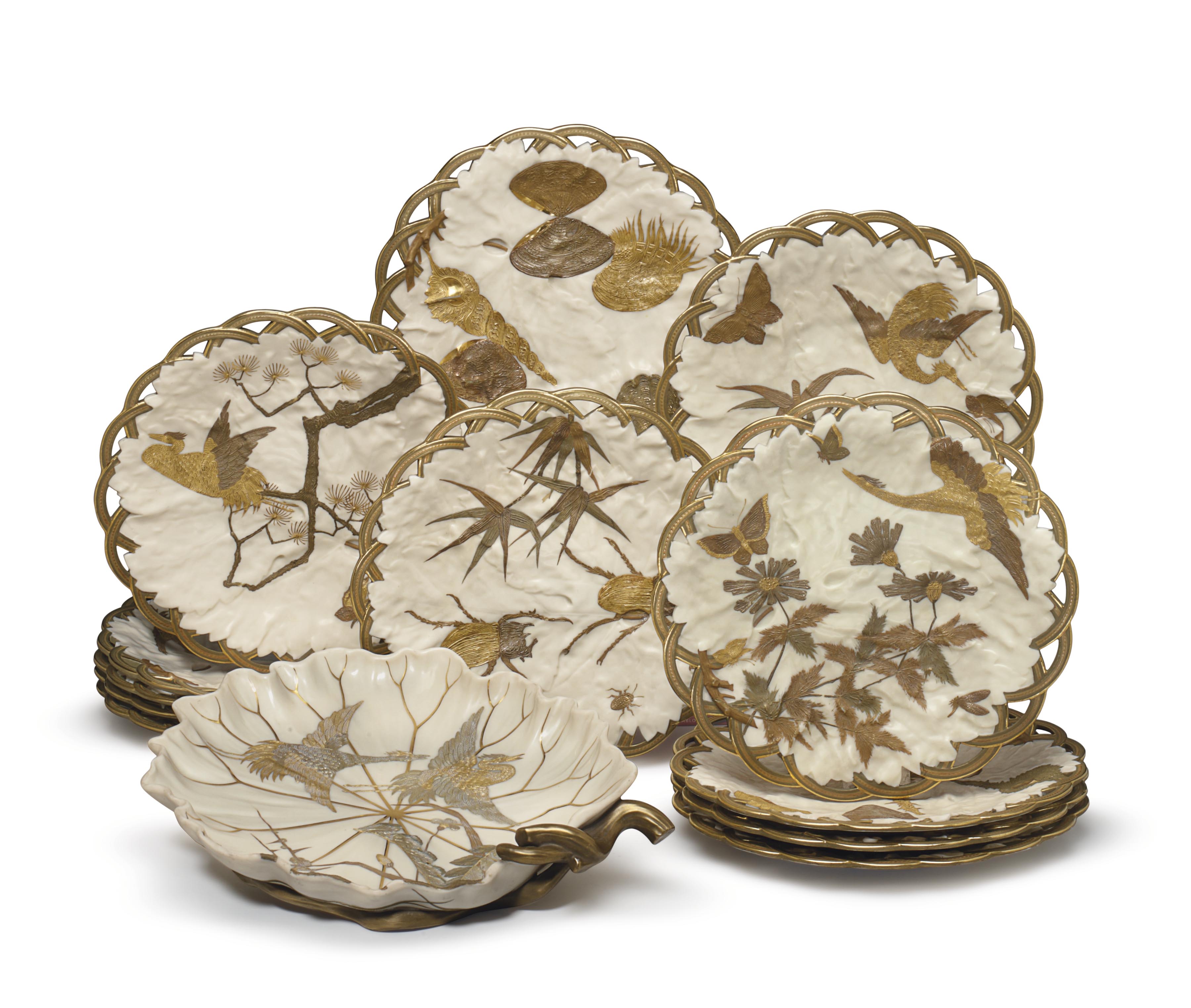 TWELVE ROYAL WORCESTER PORCELAIN IVORYGROUND PLATES AND A SERVING DISH