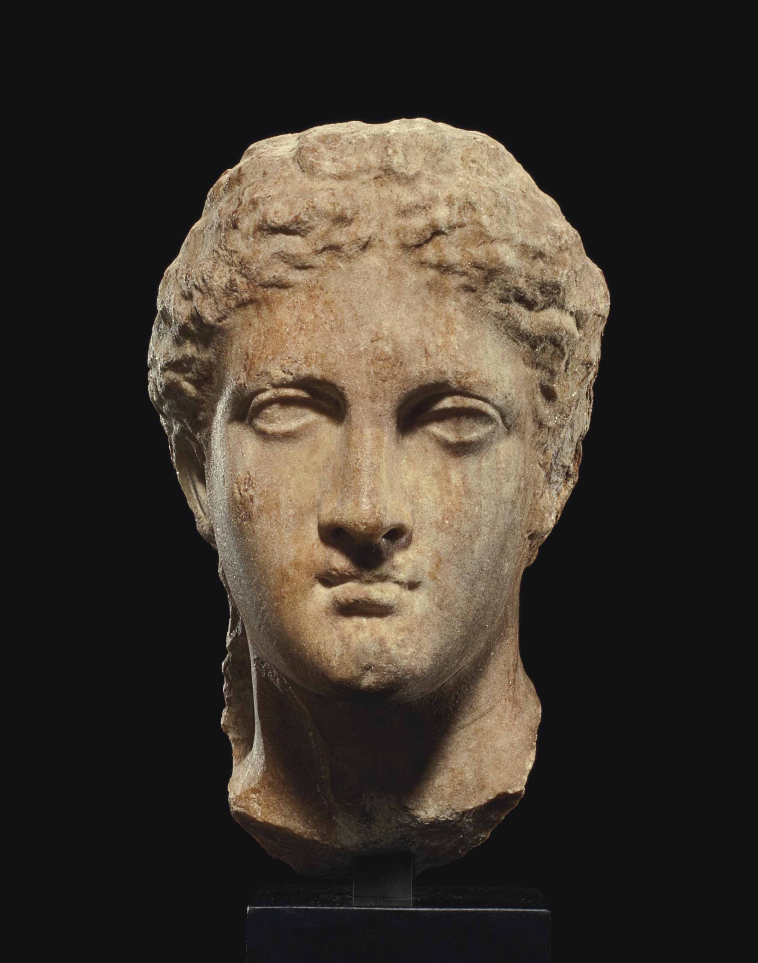 A GREEK MARBLE HEAD , LATE CLASSICAL TO EARLY HELLENISTIC PERIOD, CIRCA