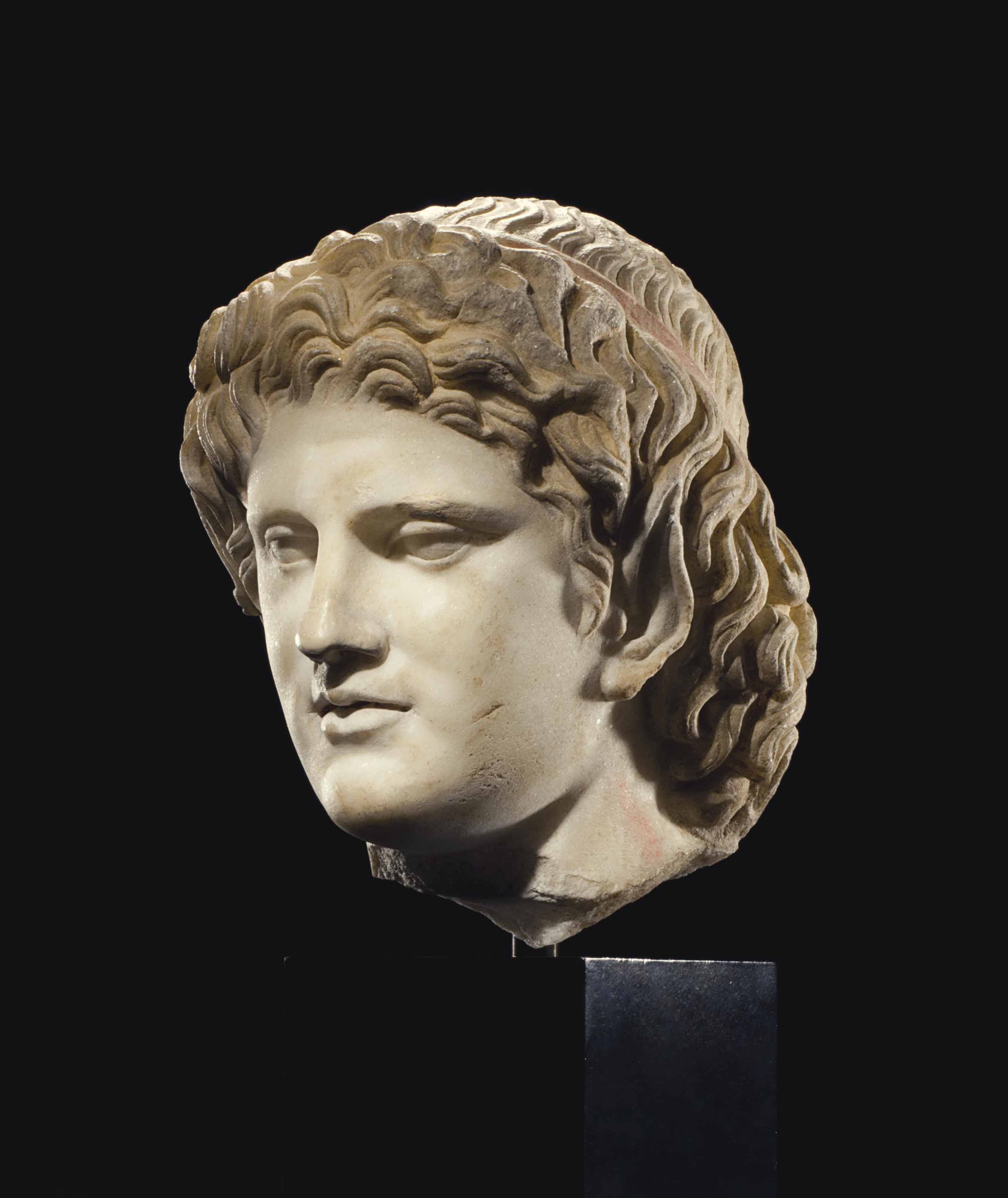 A ROMAN MARBLE HEAD OF A SATYR CIRCA 1ST 2ND CENTURY A D 