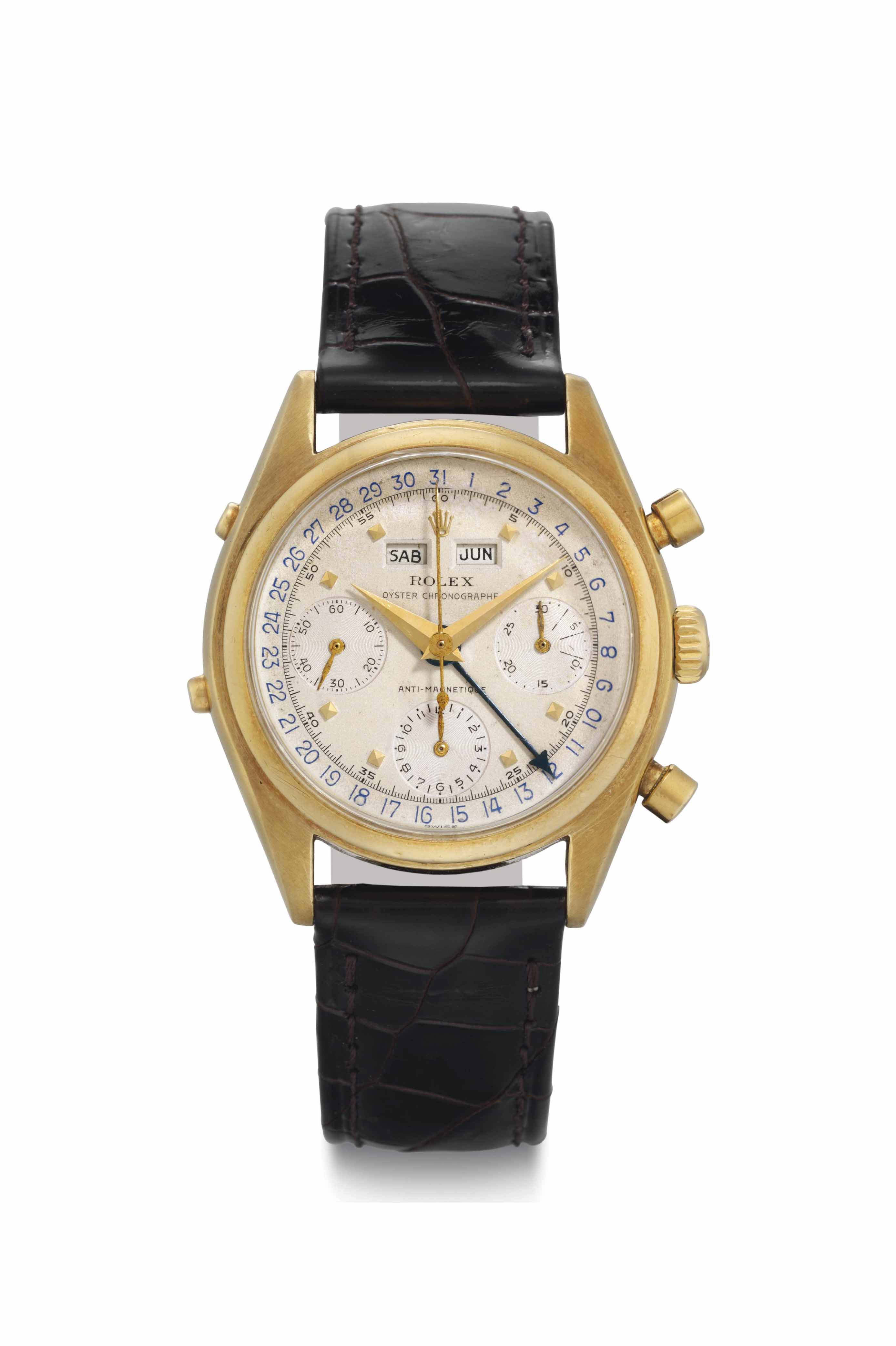 Rolex A Very Fine and Rare 18k Gold Triple Calendar Chronograph