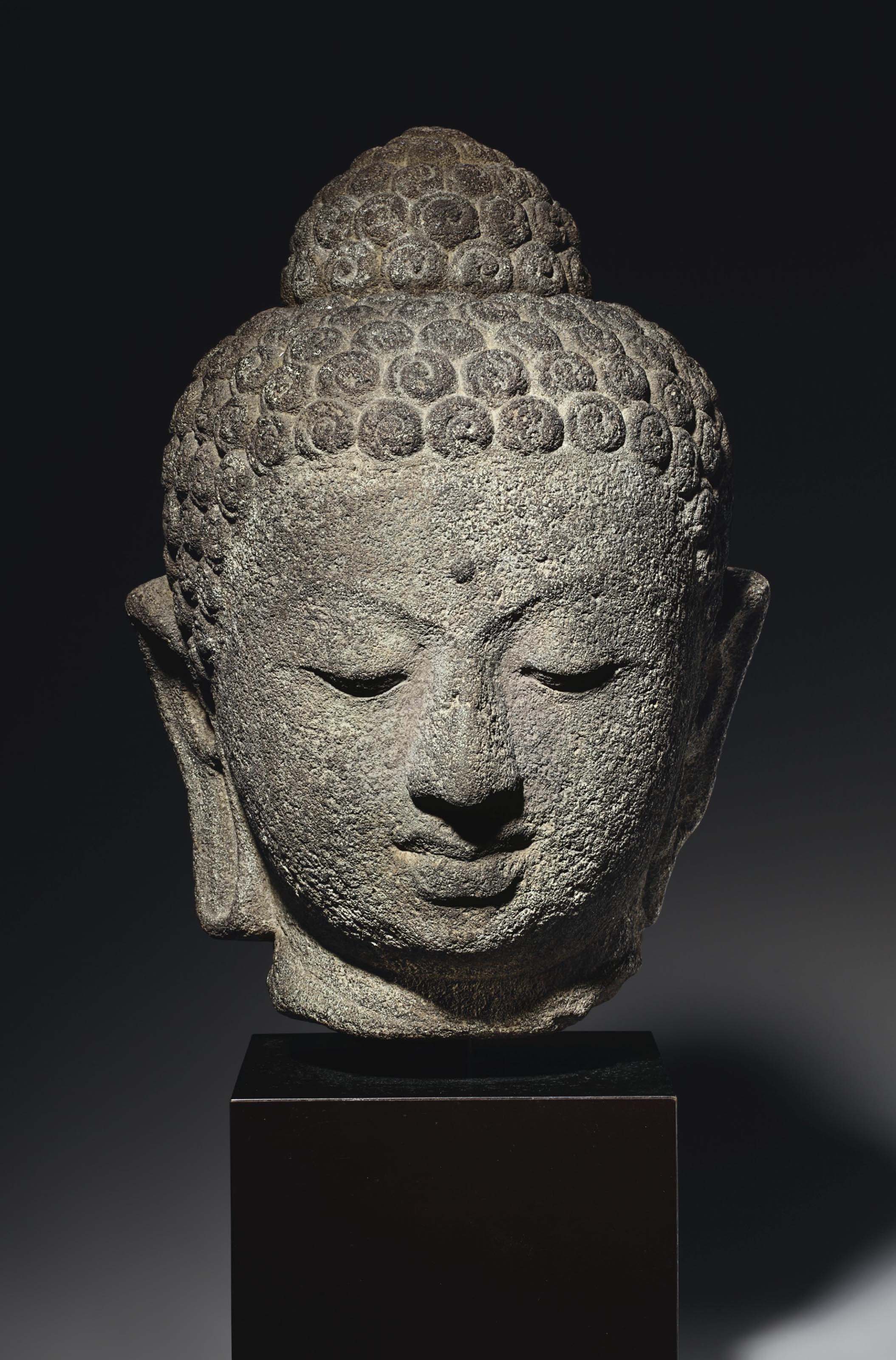 An andesite head of Buddha  INDONESIA  CENTRAL JAVA 9TH 