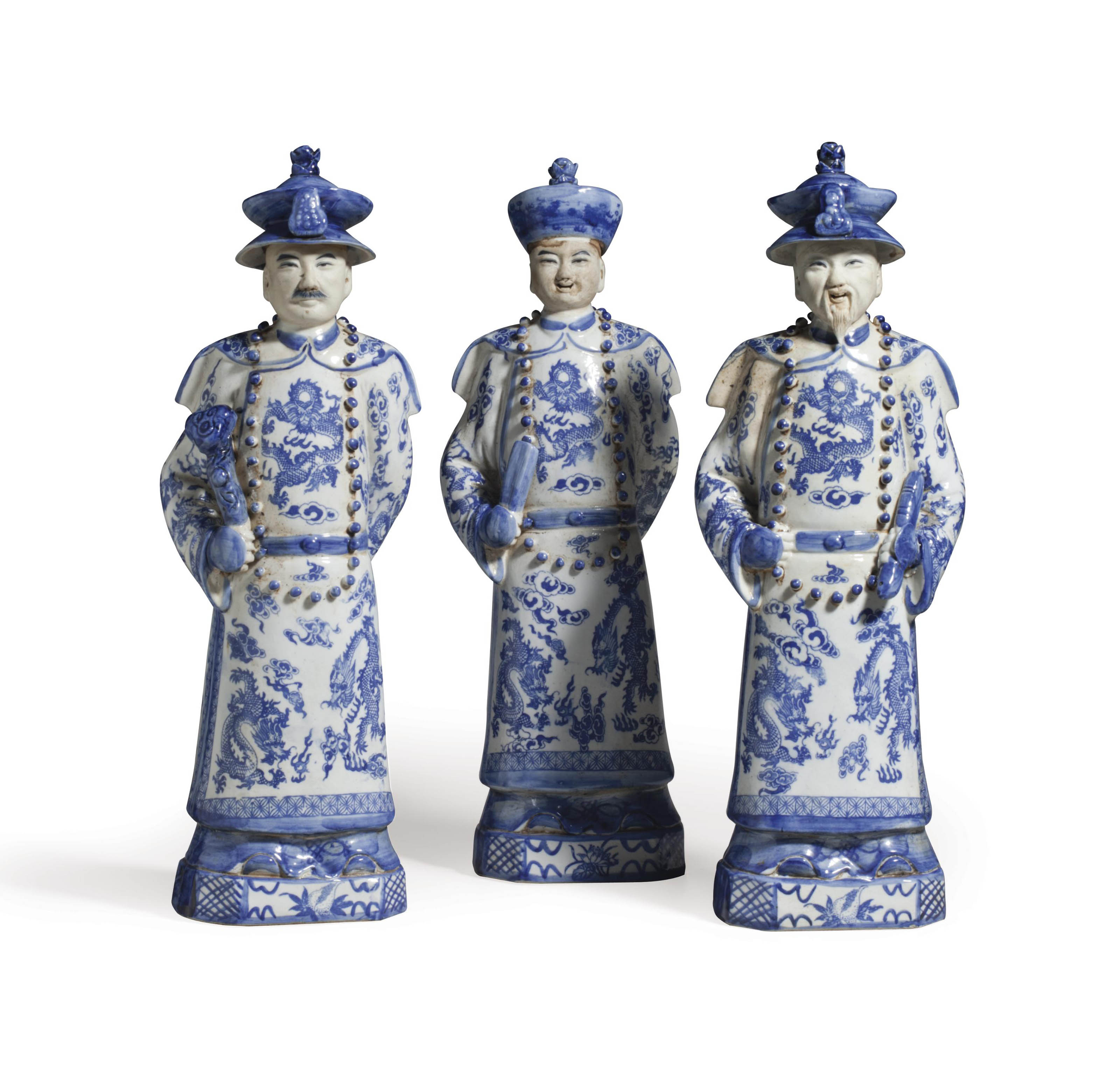 THREE CHINESE PORCELAIN BLUE AND WHITE PORCELAIN FIGURES OF OFFICIALS
