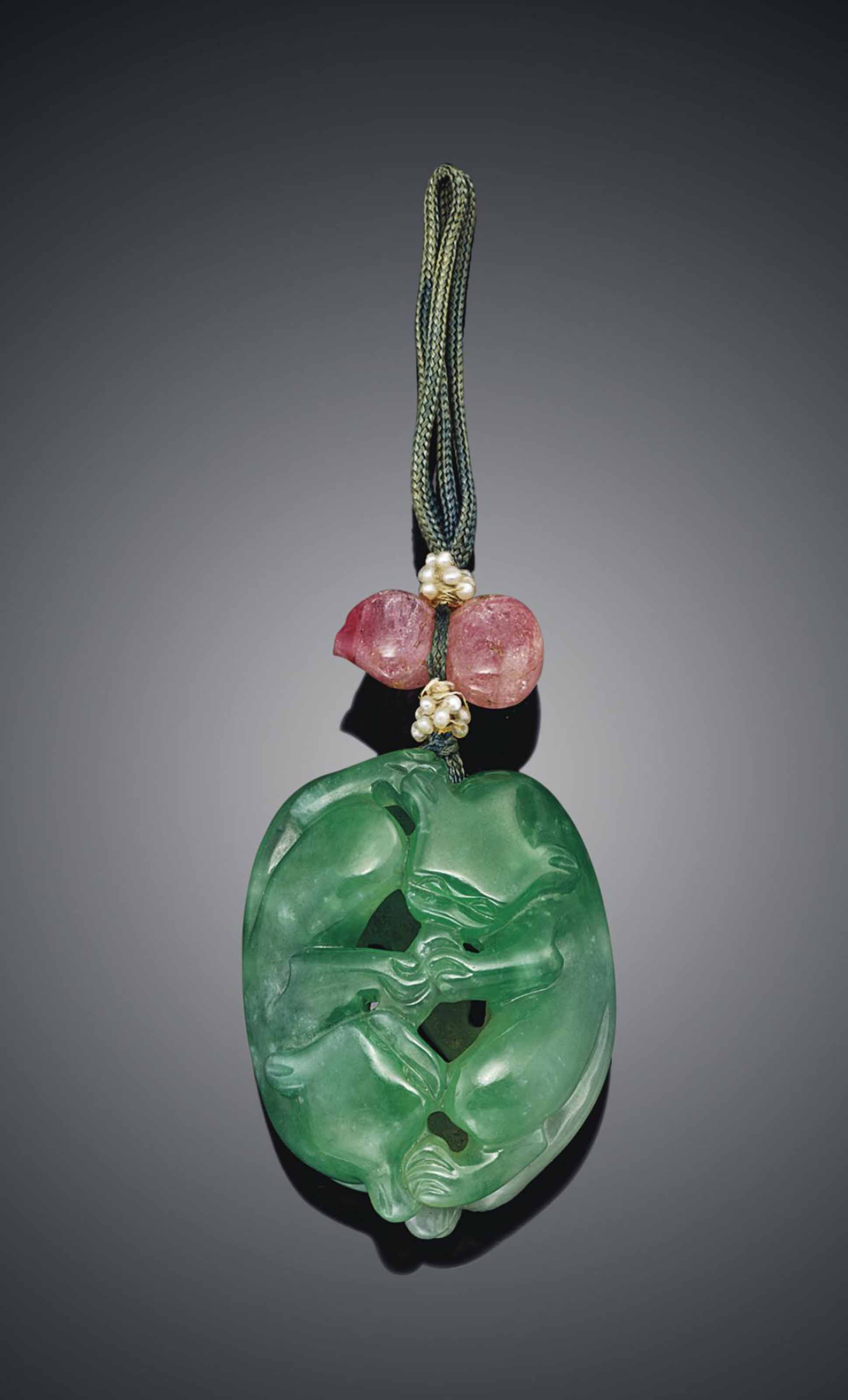 A GREEN JADEITE CARVED PENDANT , 19TH CENTURY Christie's