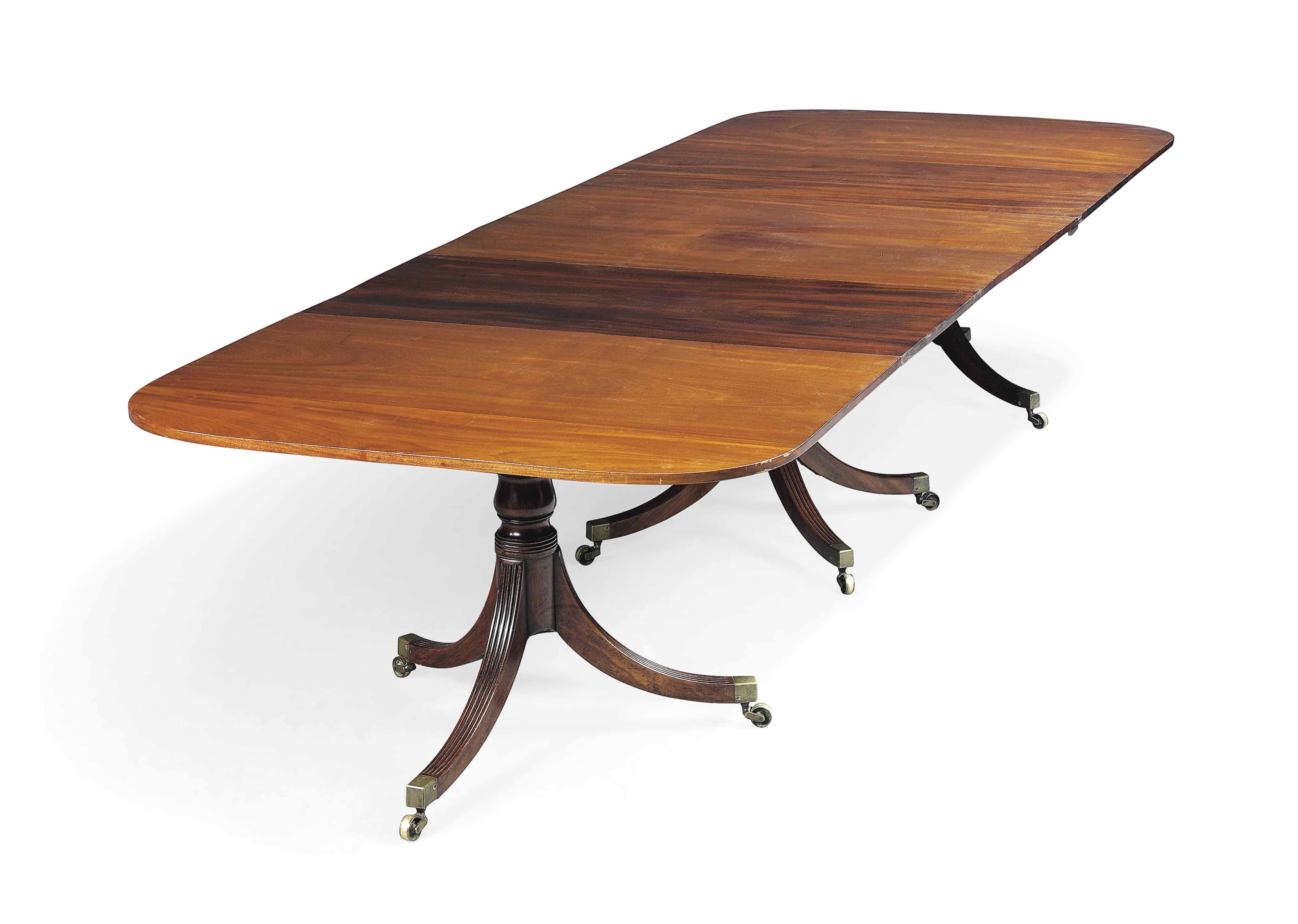 A III MAHOGANY TRIPLE PEDESTAL DININGTABLE