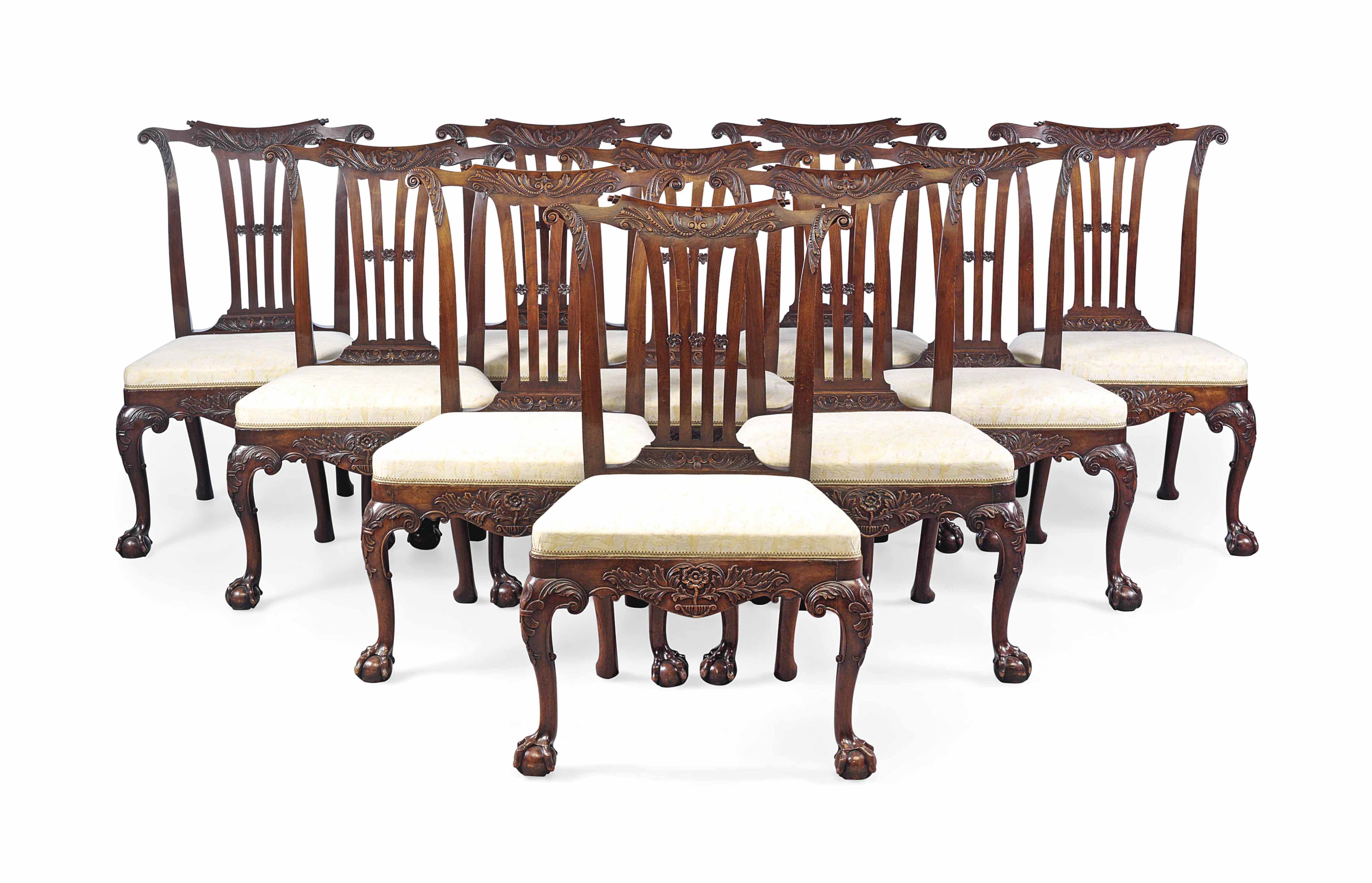 A SET OF NINE II WALNUT DININGCHAIRS