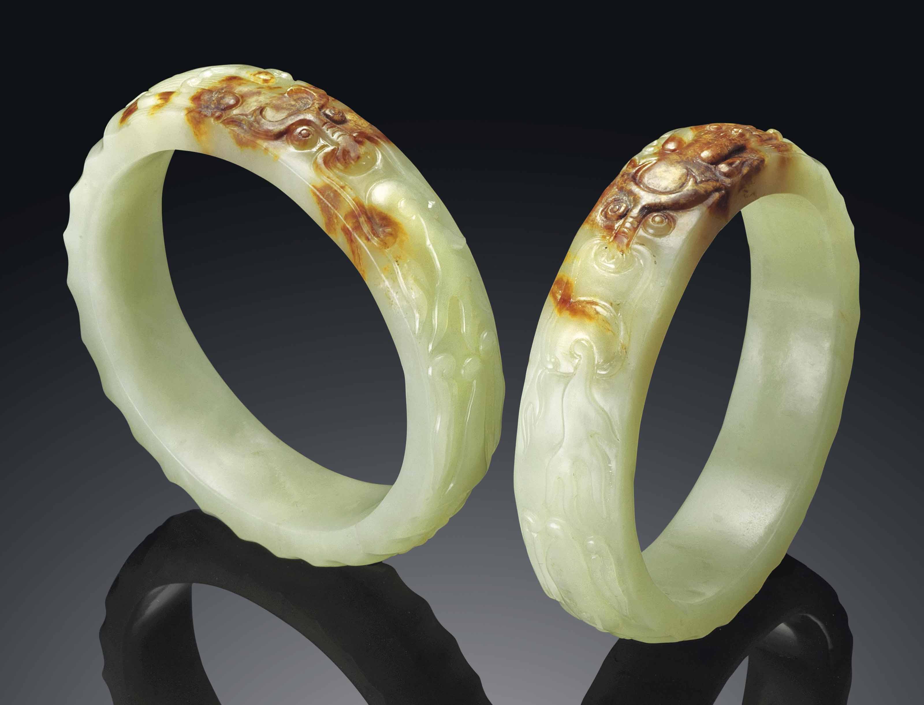 A PAIR OF YELLOW JADE CARVED BANGLES , QING DYNASTY (16441911