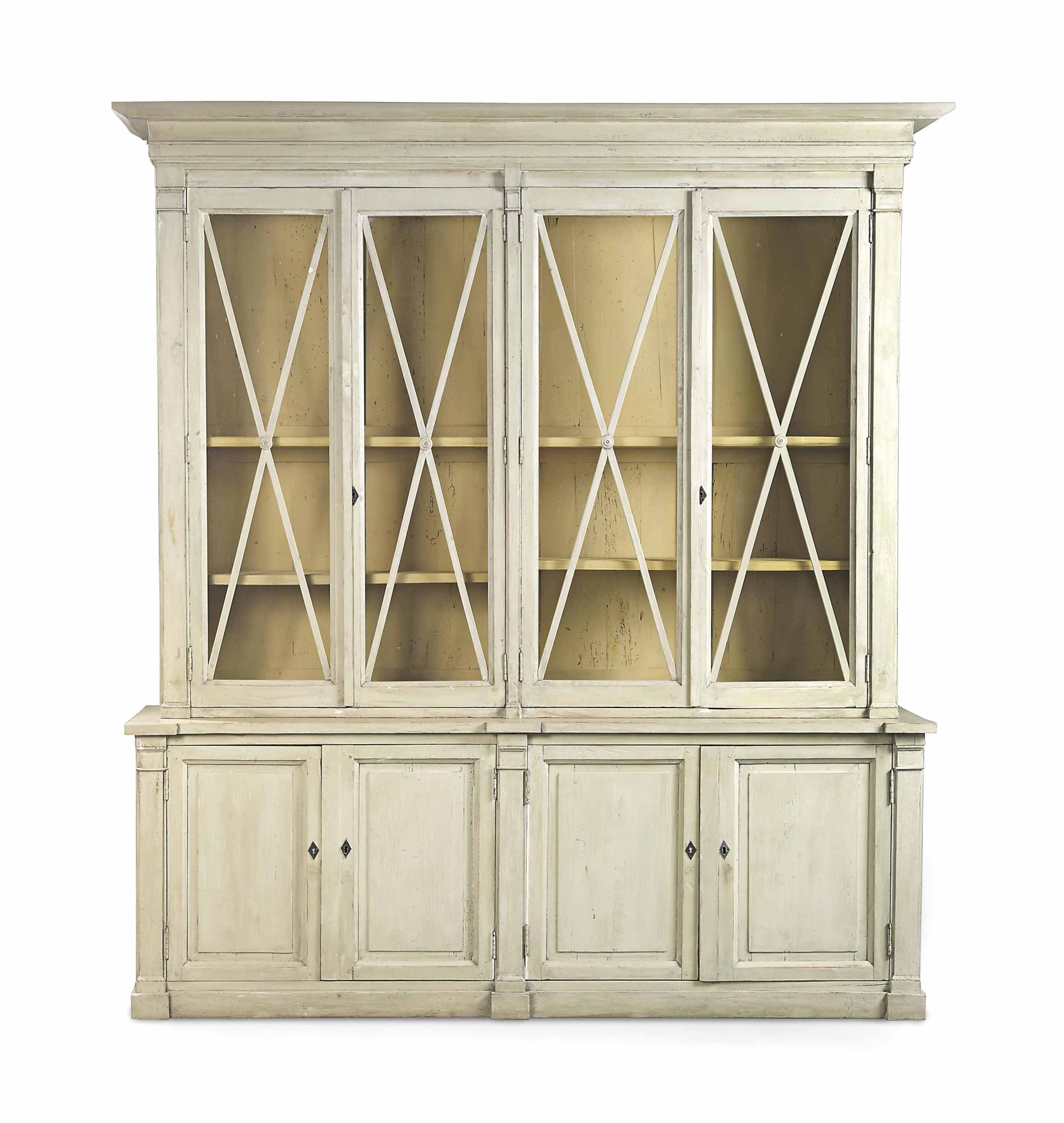 A FRENCH PROVINCIAL WHITEPAINTED BOOKCASE , EARLY 19TH CENTURY AND