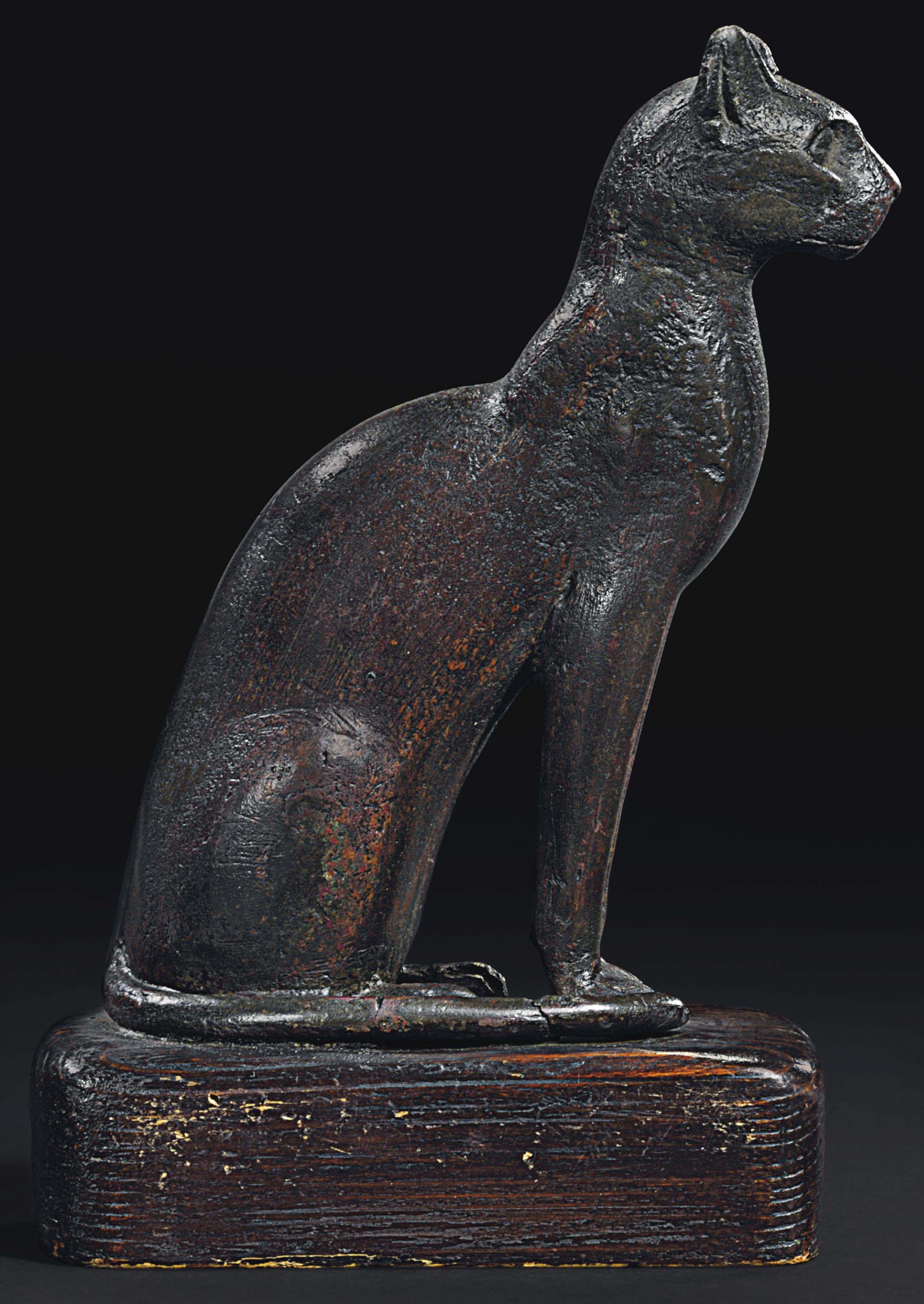 AN EGYPTIAN BRONZE CAT