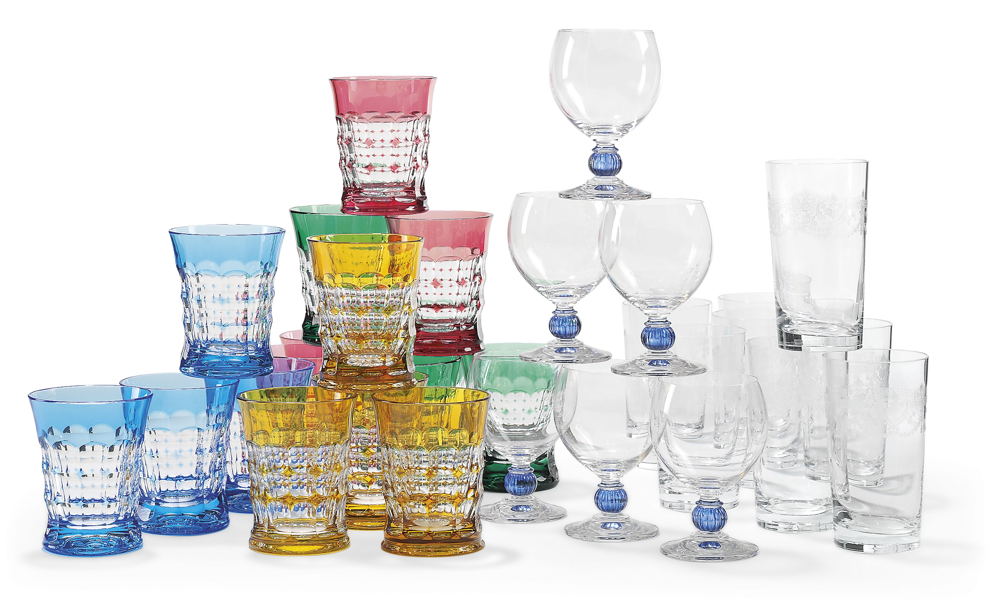 A MODERN CHRISTIAN LACROIX COLOURED GLASS PART TABLE-SERVICE AND OTHER  ITEMS OF GLASSWARE ETCHED MARKS, Comprising: a moulded glass table-service  tinted in ruby, yellow, blue and green, two chipped, comprising four waisted