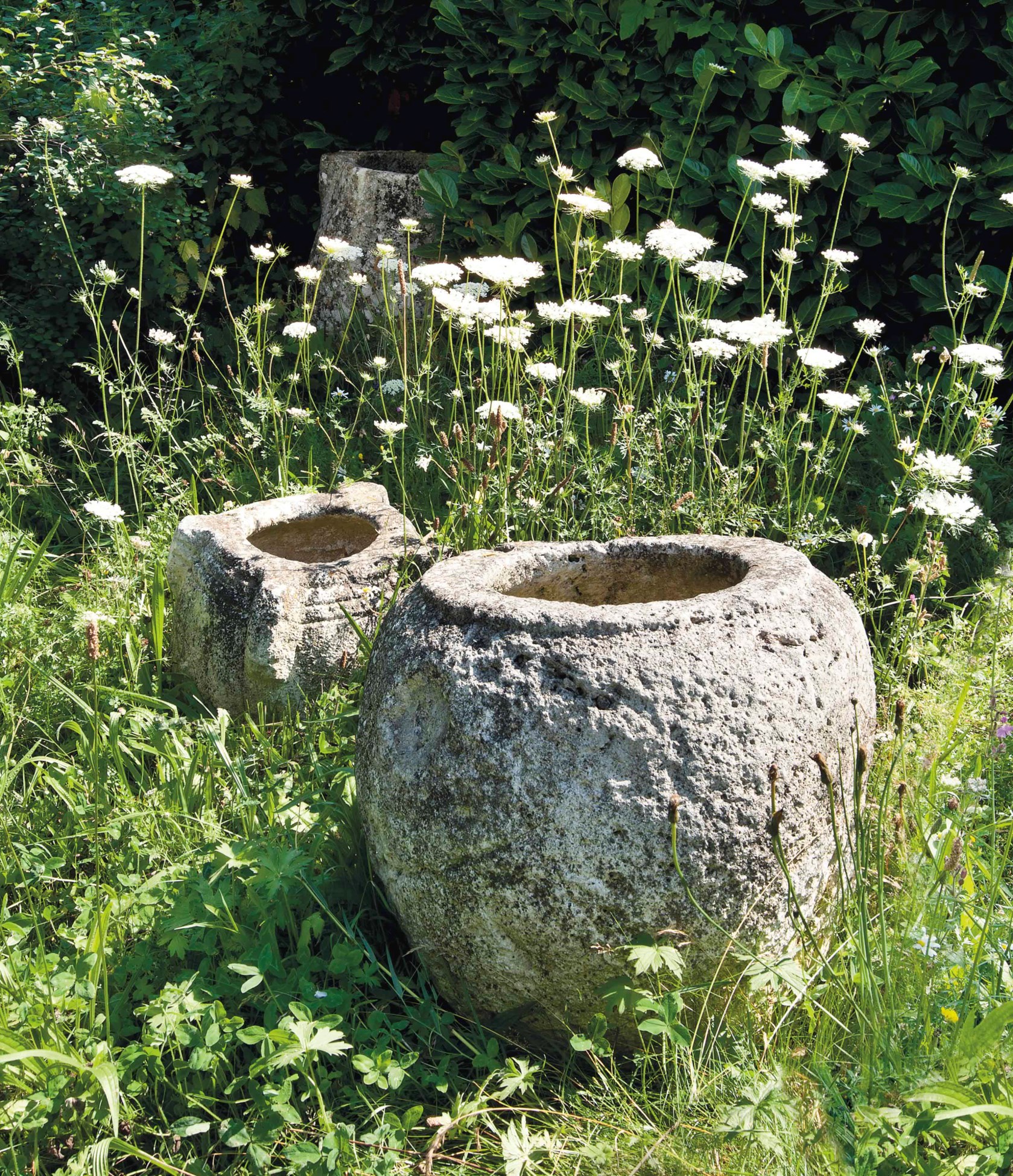A COLLECTION OF THREE SPANISH ROUGH HEWN STONE VESSELS